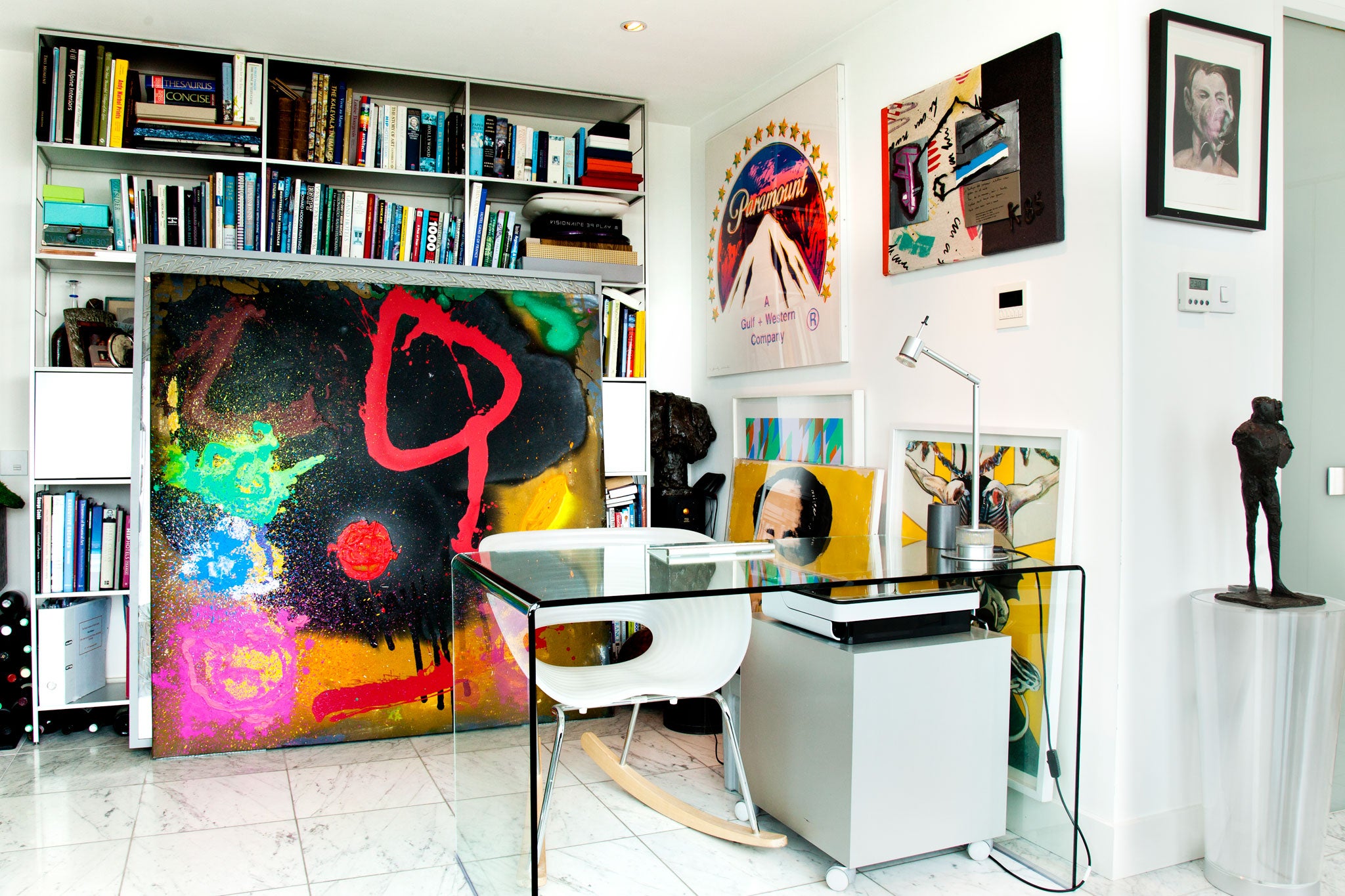 Berthold's study, with a Francis Bacon print, a Warhol and a Martin Kippenberger on the wall, an Isa Genzken sculpture, plus several works ready to go into storage