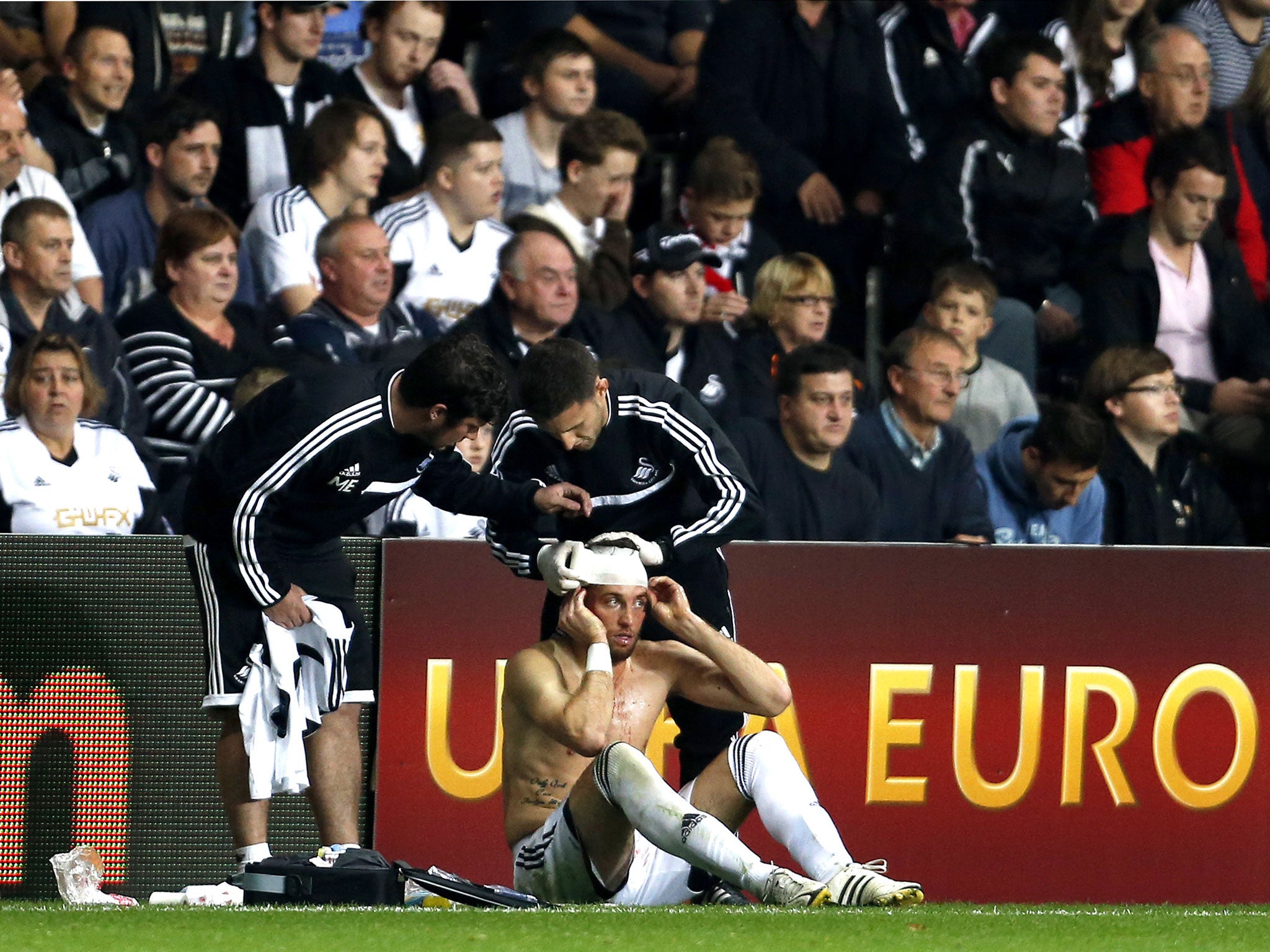 Michu has his head bandaged after suffering a cut to the head in the win over St Gallen