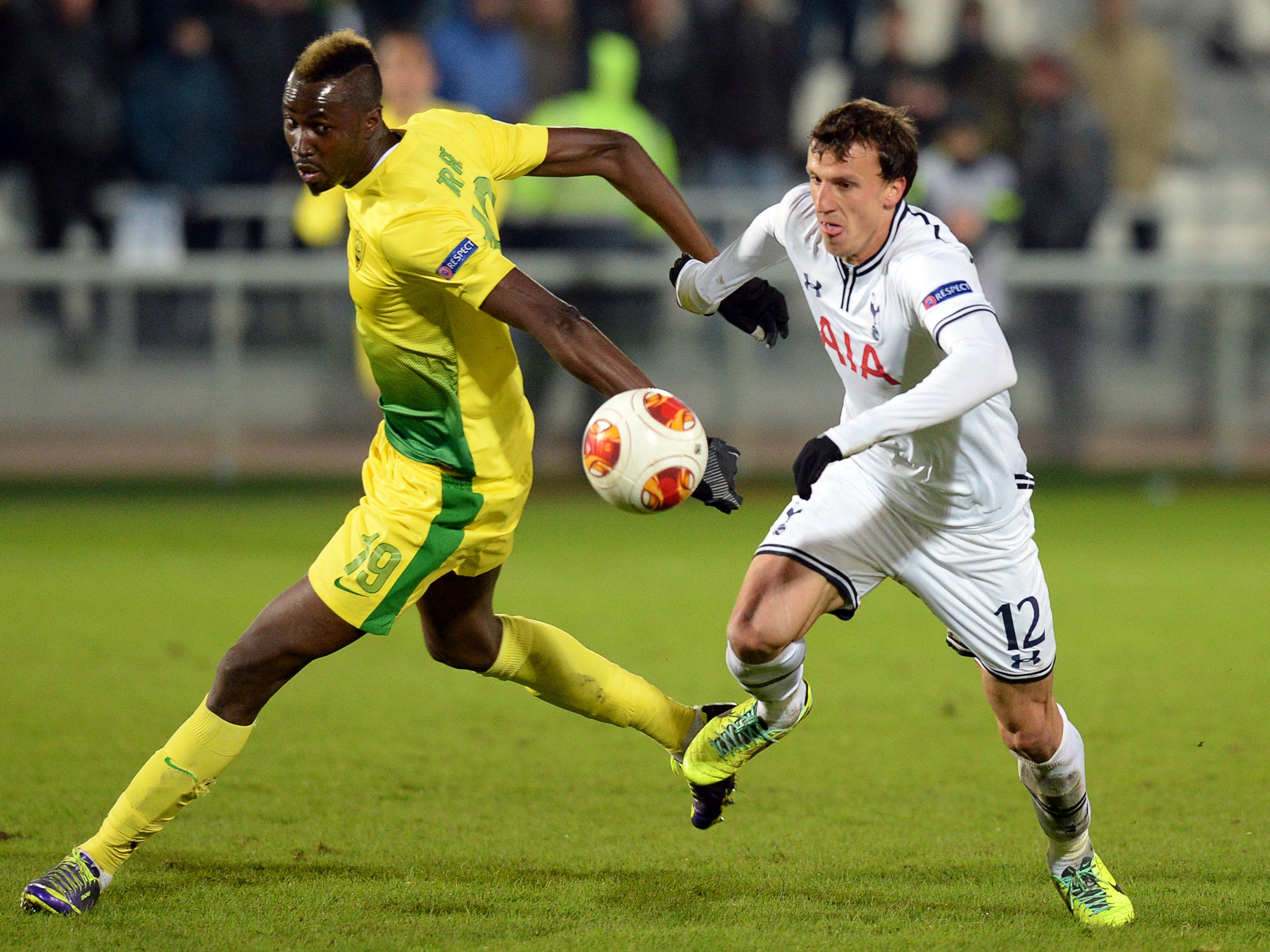 Vlad Chiriches of Tottenham dispossesses Lacina Traore of Anzhi Makhachkala