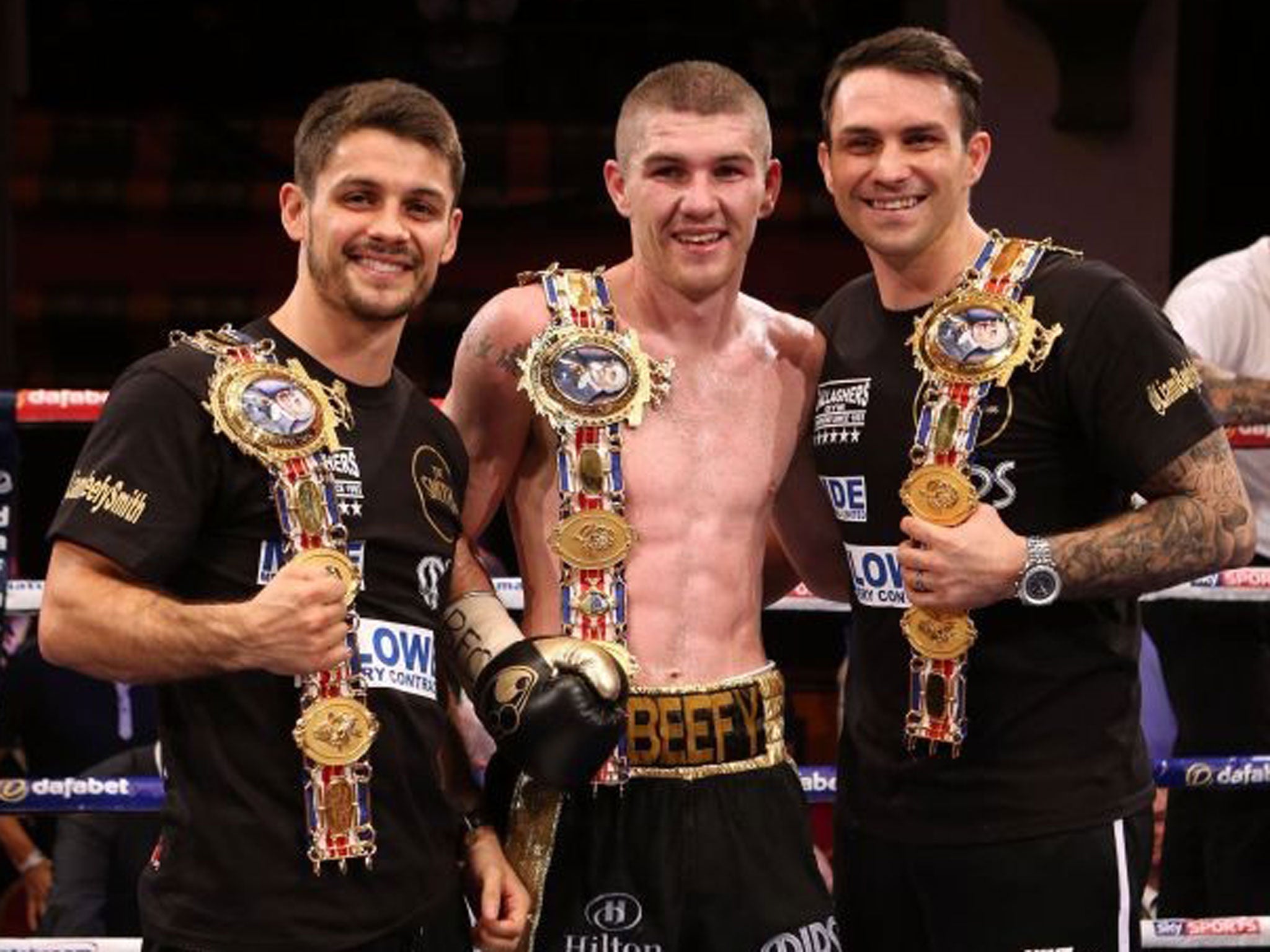Brothers in arms: Stephen Smith (left) and Paul (right) celebrate Liam’s title win