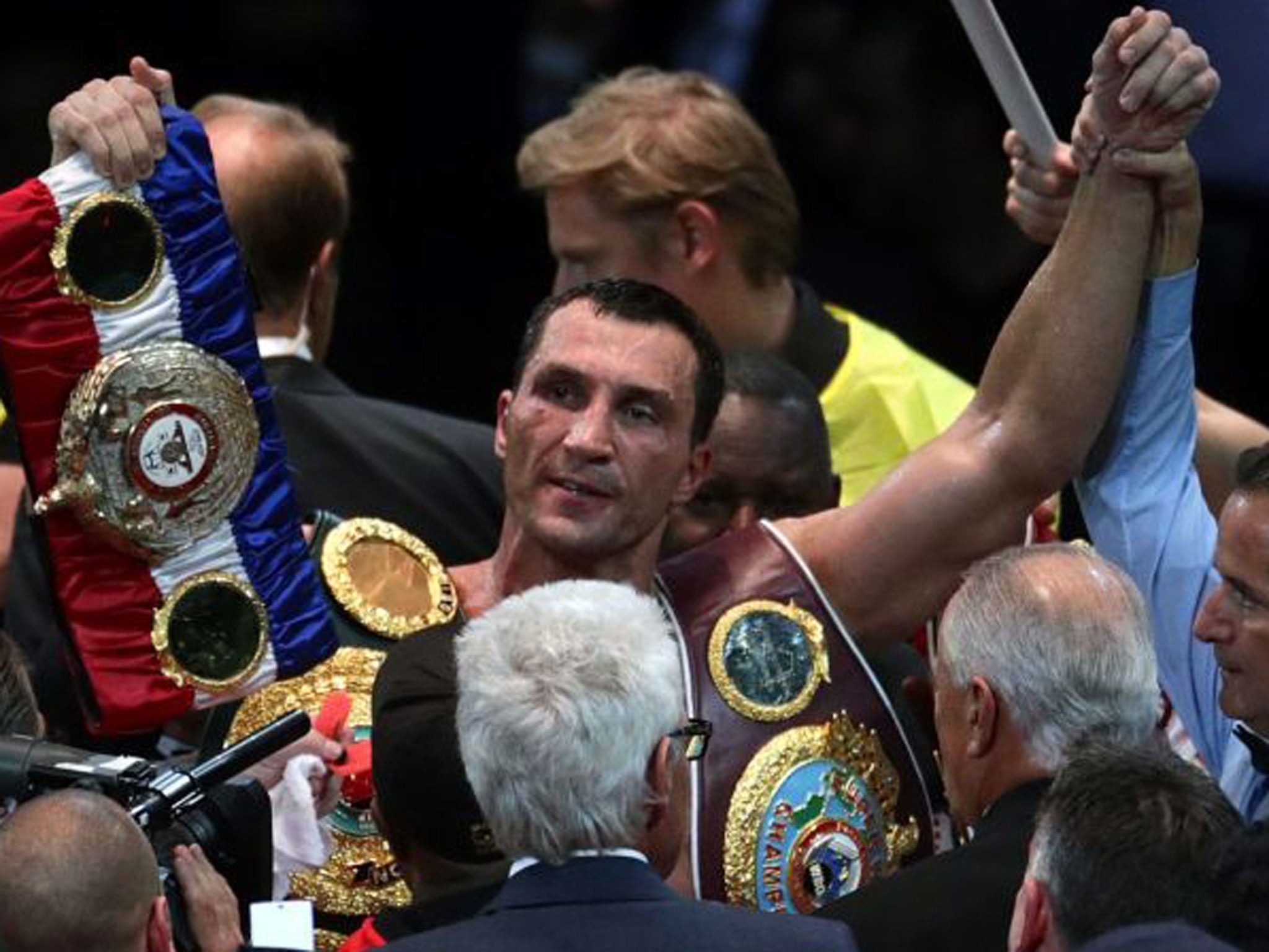 Wladimir Klitschko's hand is raised after beating Alexander Povetkin on points