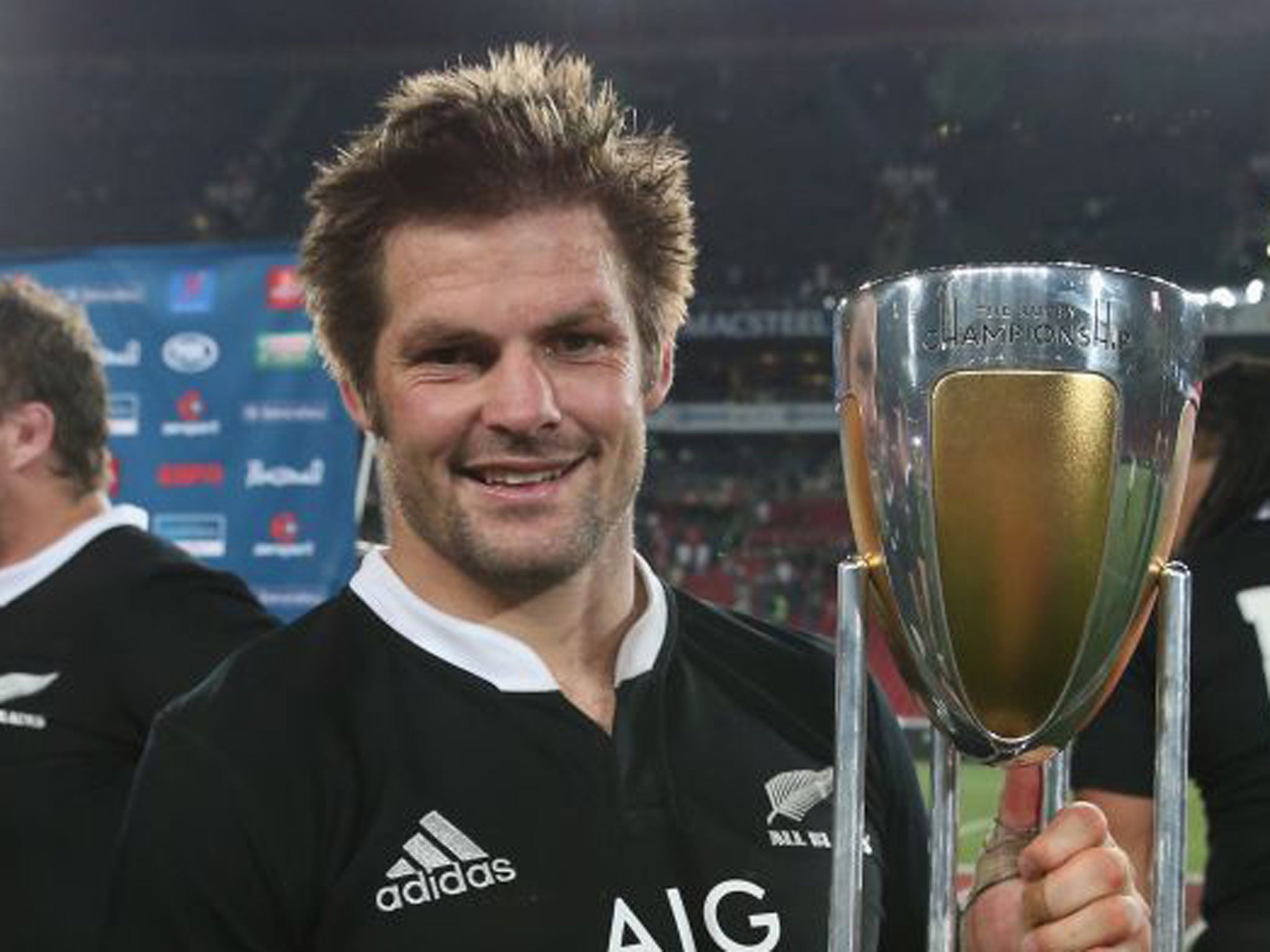 New Zealand captain Richie McCaw poses with the Championship trophy