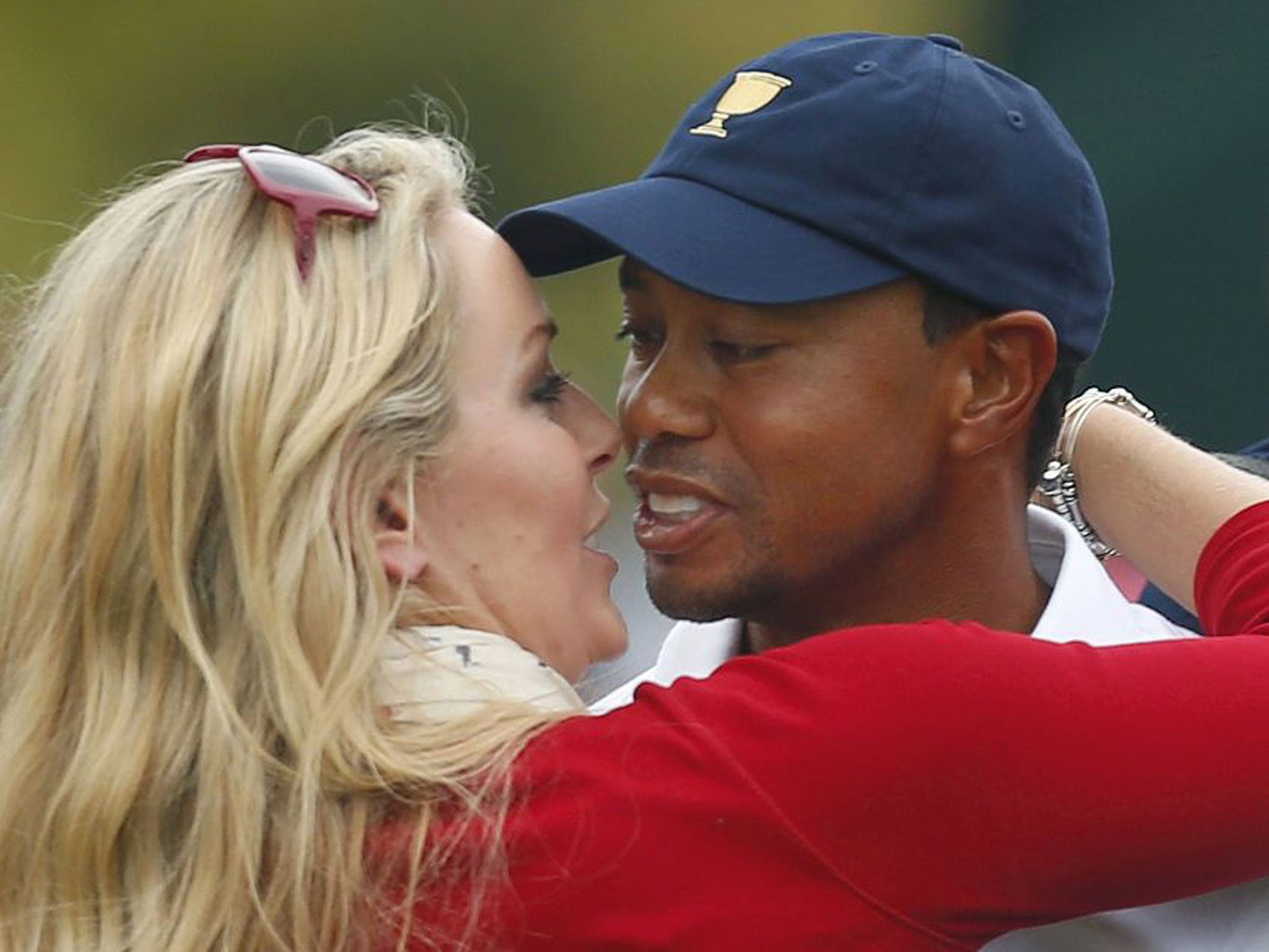 Tiger Woods, right, celebrates with girlfriend Lindsey Vonn