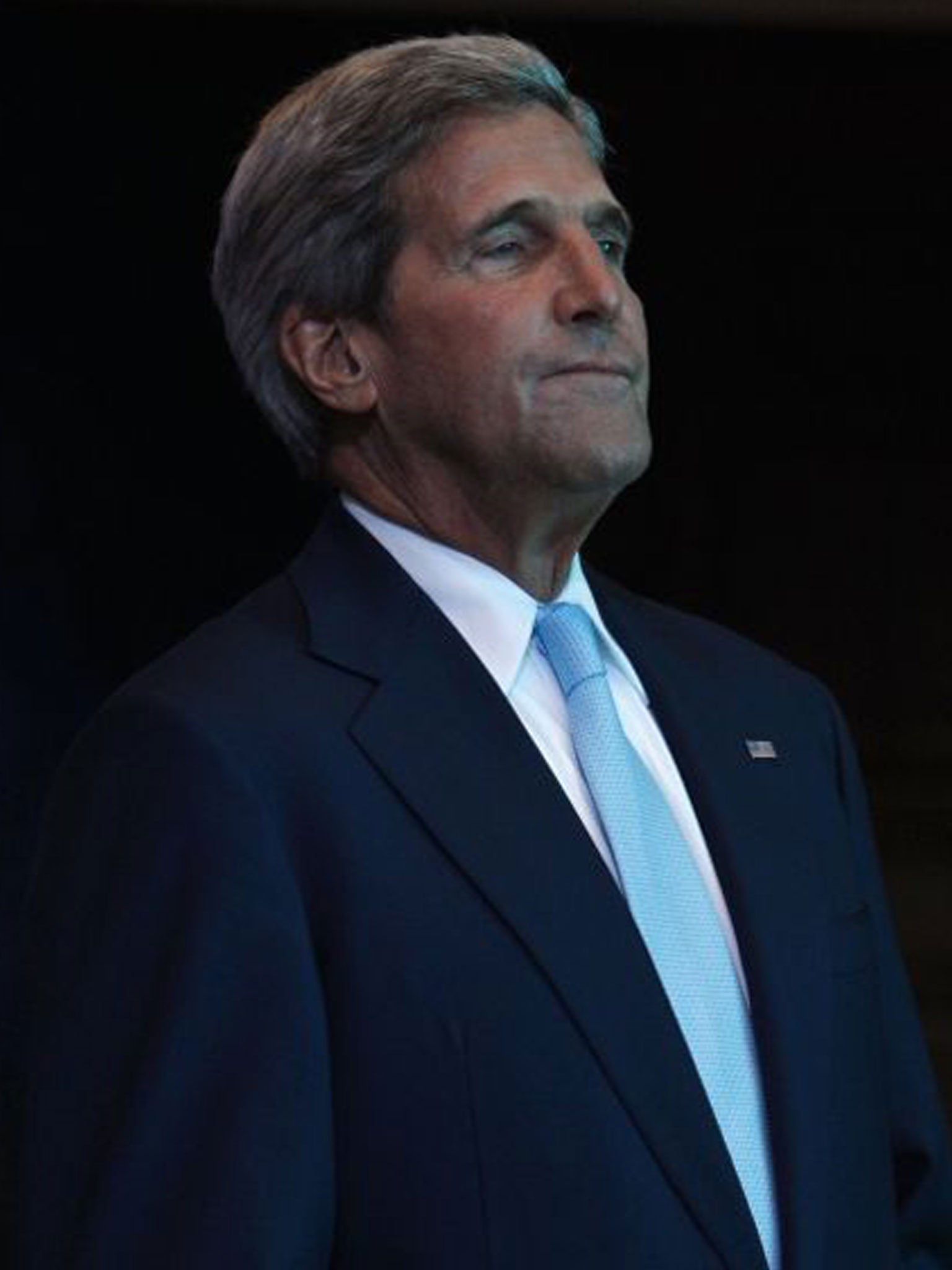 John Kerry waits to speak at the Asia-Pacific Economic Cooperation (APEC) summit in Bali, Indonesia.