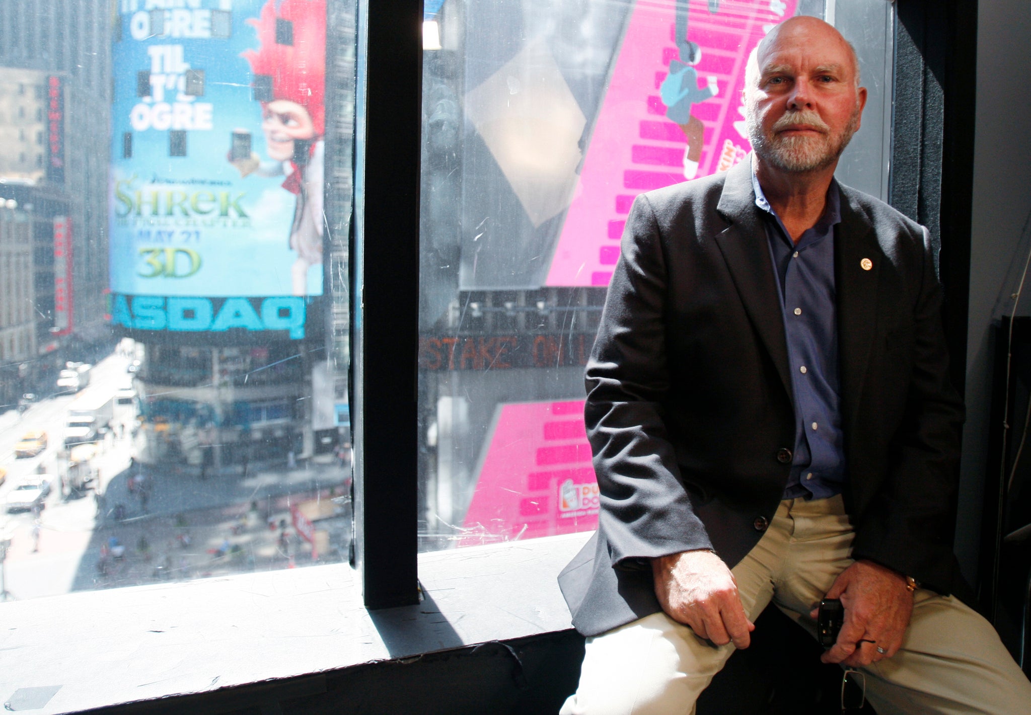 Venter poses for a photo after the 2010 announcement of his lab's creation of the first synthetic organism.