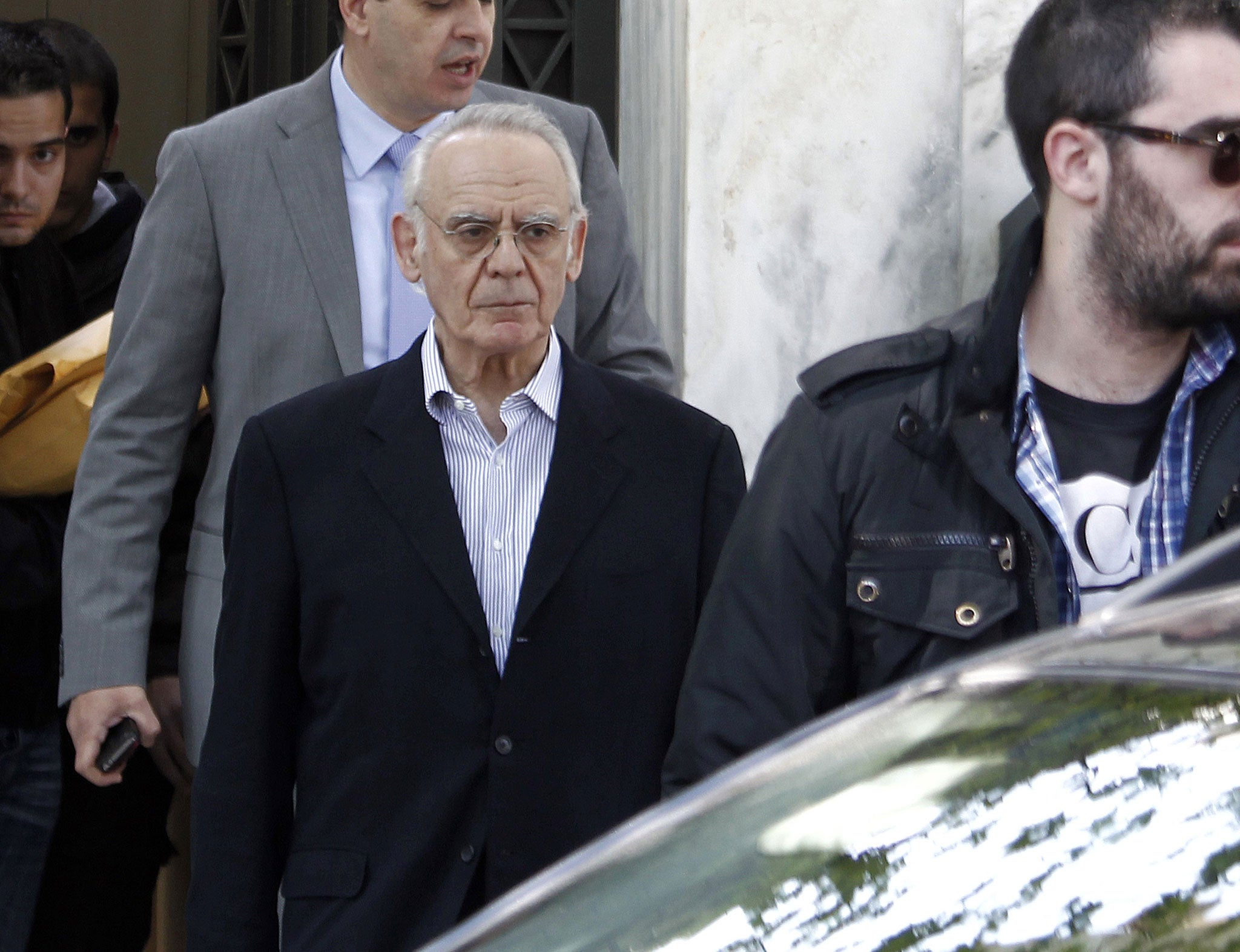 Akis Tsochatzopoulos, led from his Athens mansion after his arrest in 2012