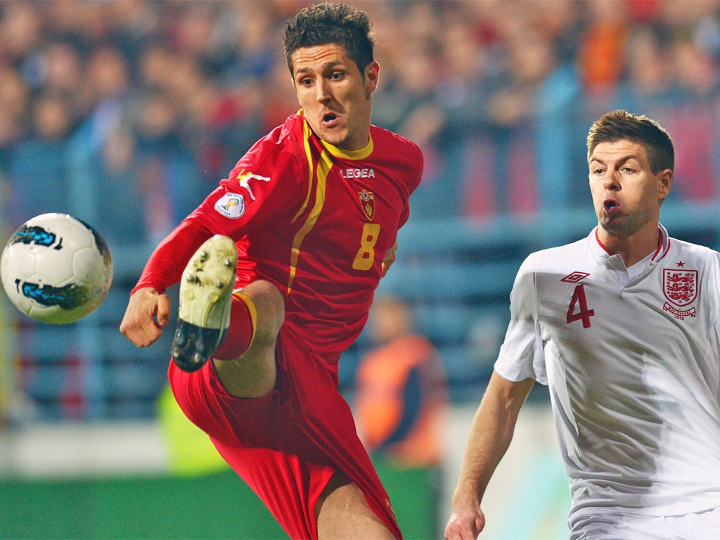 Stevan Jovetic (left) holds off Steven Gerrard during March’s 1-1 draw in Podgorica