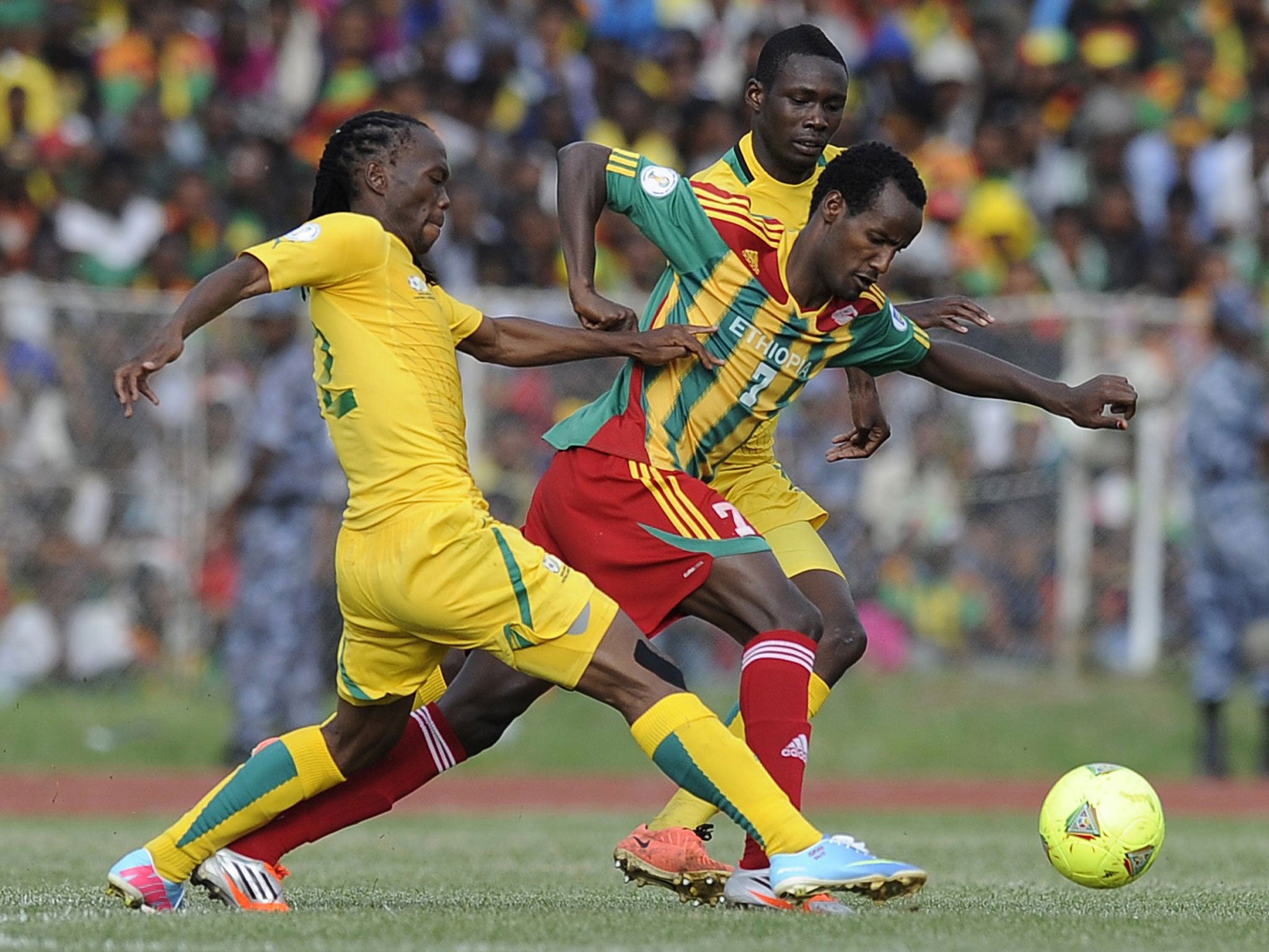 Ethiopia's Saladin Said wriggles away from two South African opponents in June's qualifier