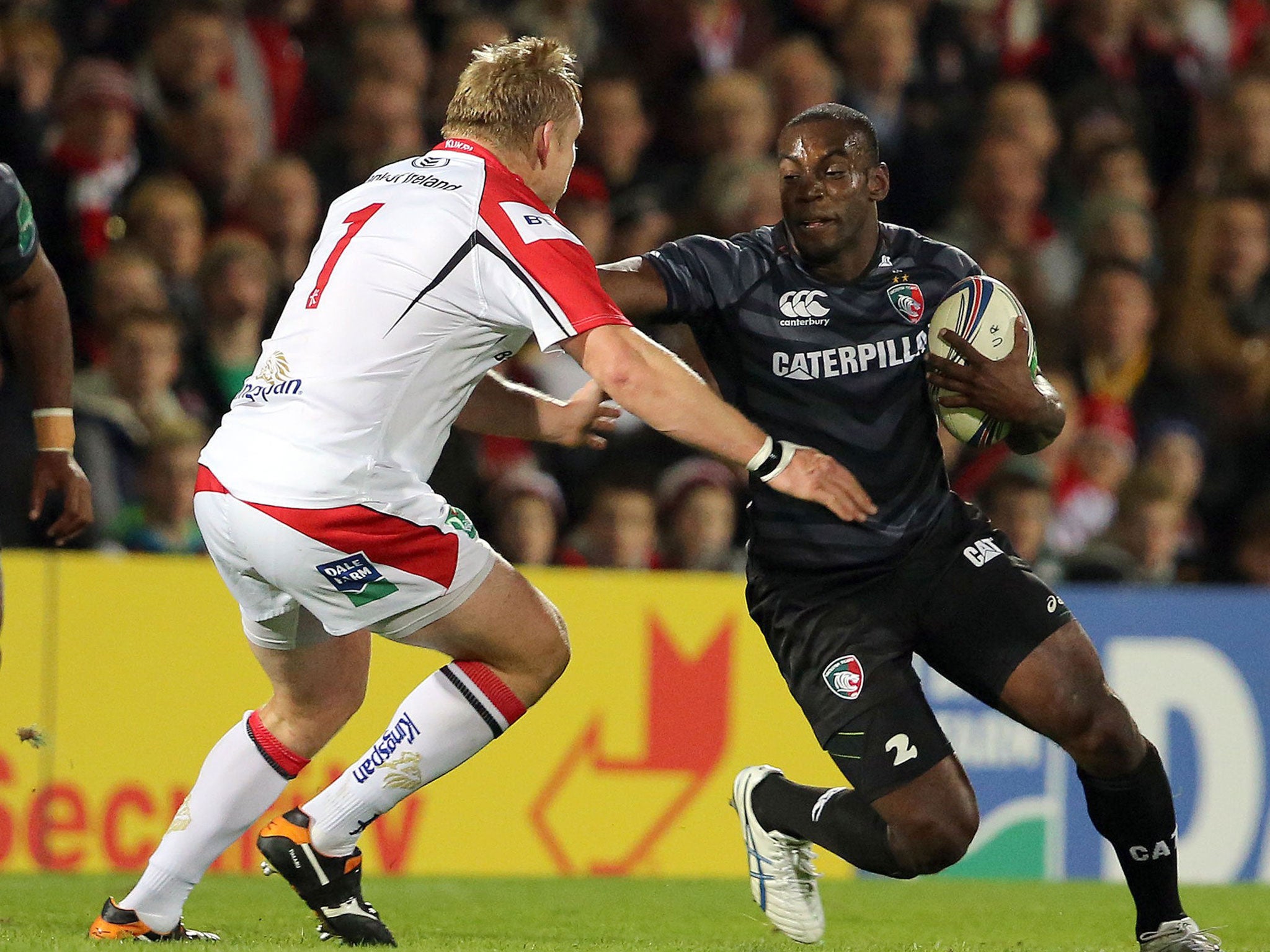 Leicester's Miles Benjamin hands off Tom Court