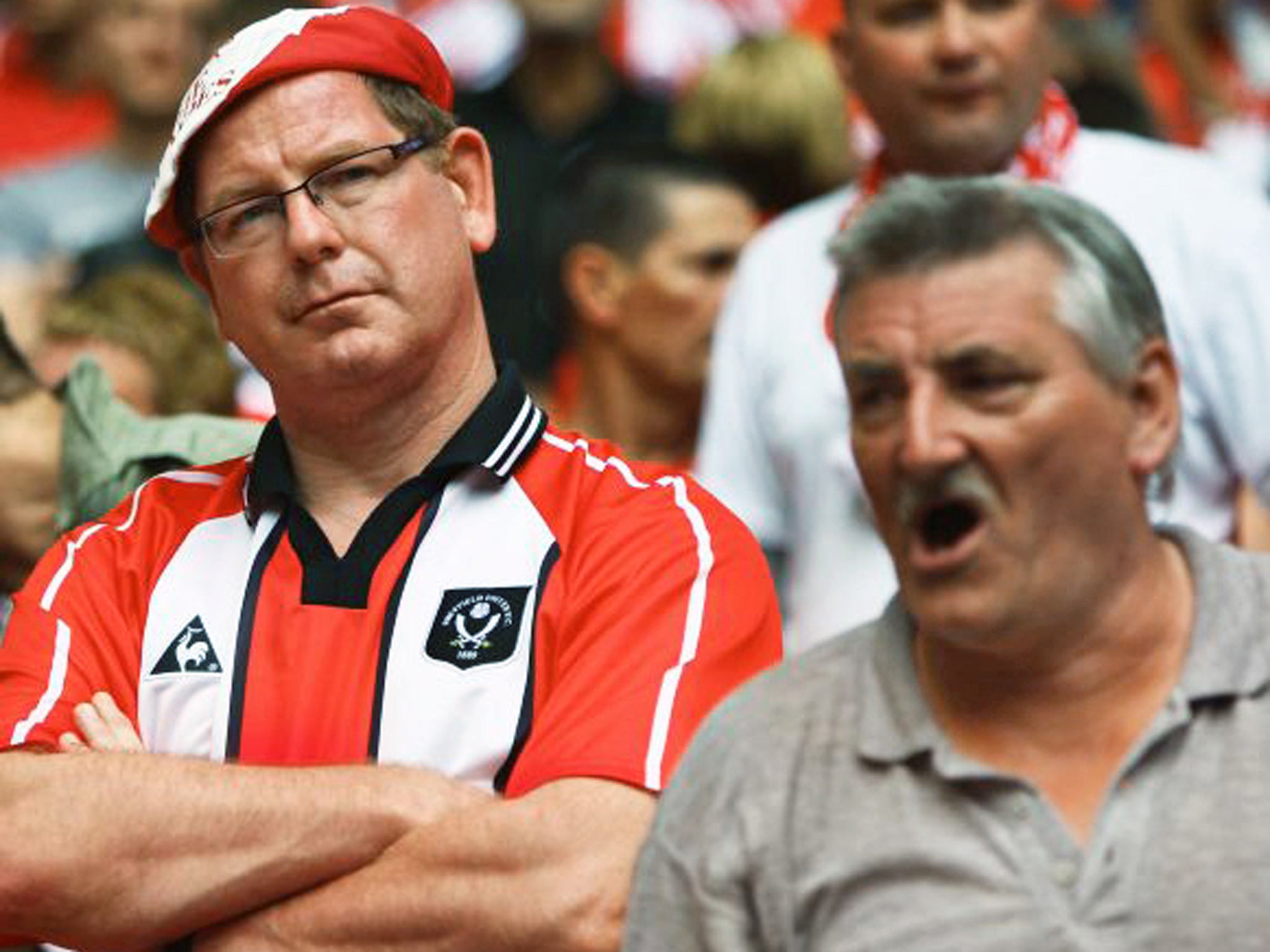 Sheffield United fans appear dejected with their side