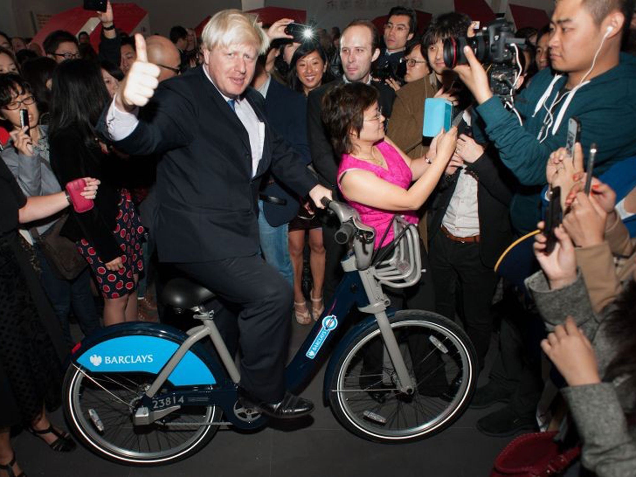 Boris Johnson begins a six-day trade mission to Beijing by posing on a 'Boris Bike'