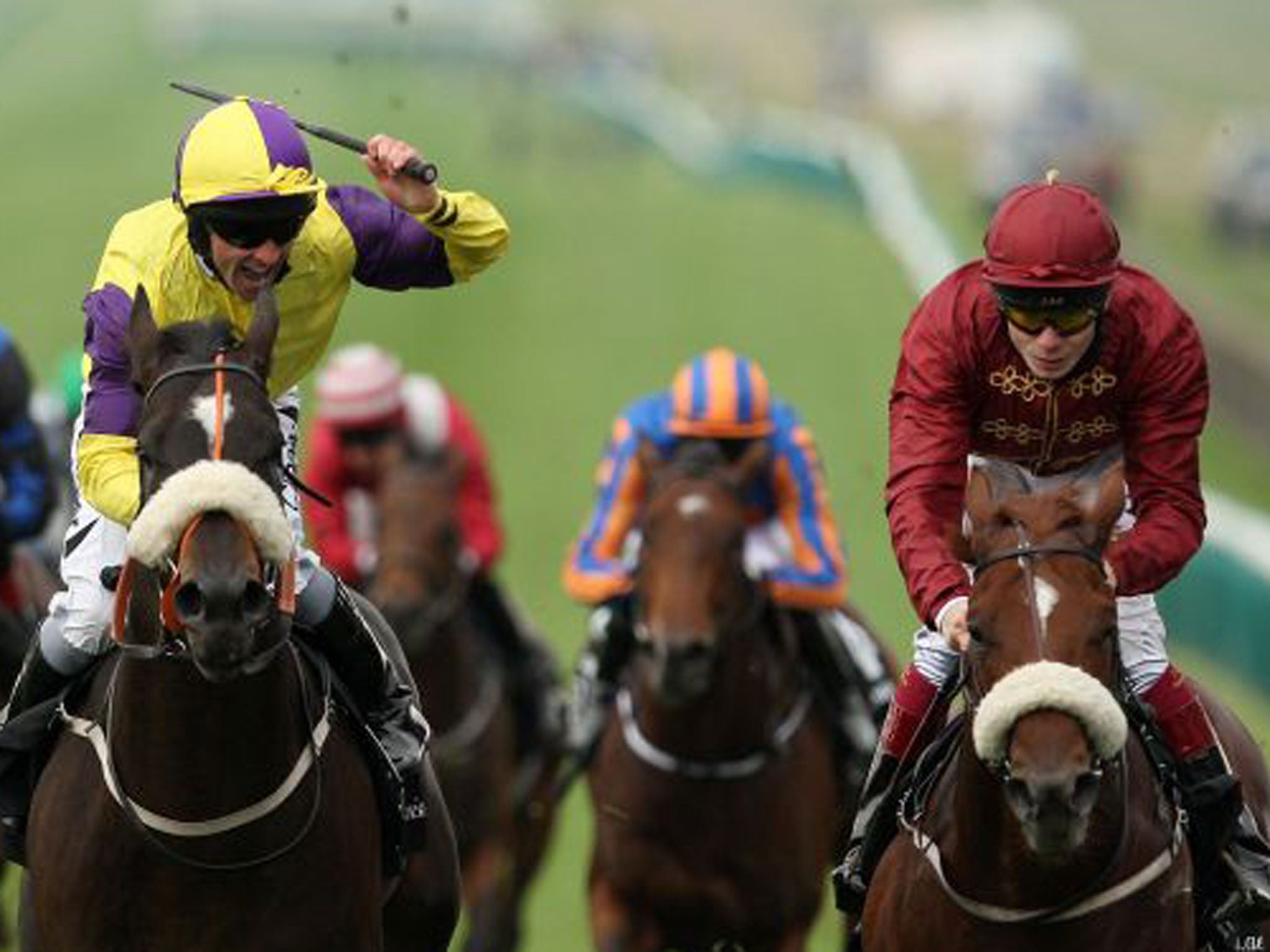 Neil Callan celebrates victory in Newmarket’s Middle Park Stakes aboard Astaire, whose stablemate Hot Streak (right) was runner-up