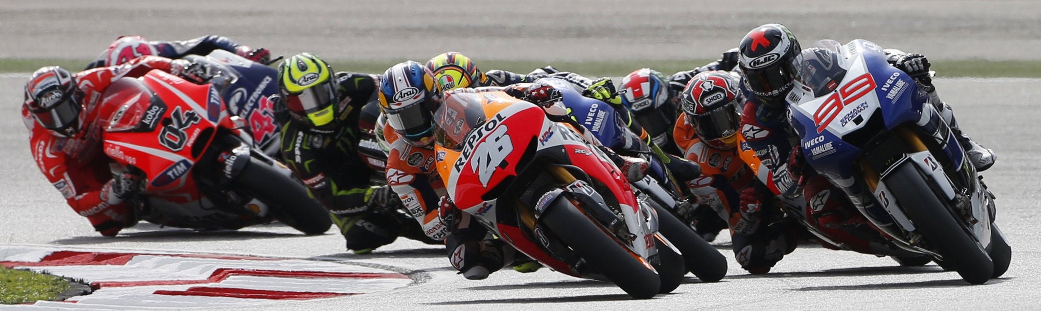 Dani Pedrosa (26) leads the pack on his way to victory at the Malaysian Moto GP in Sepang