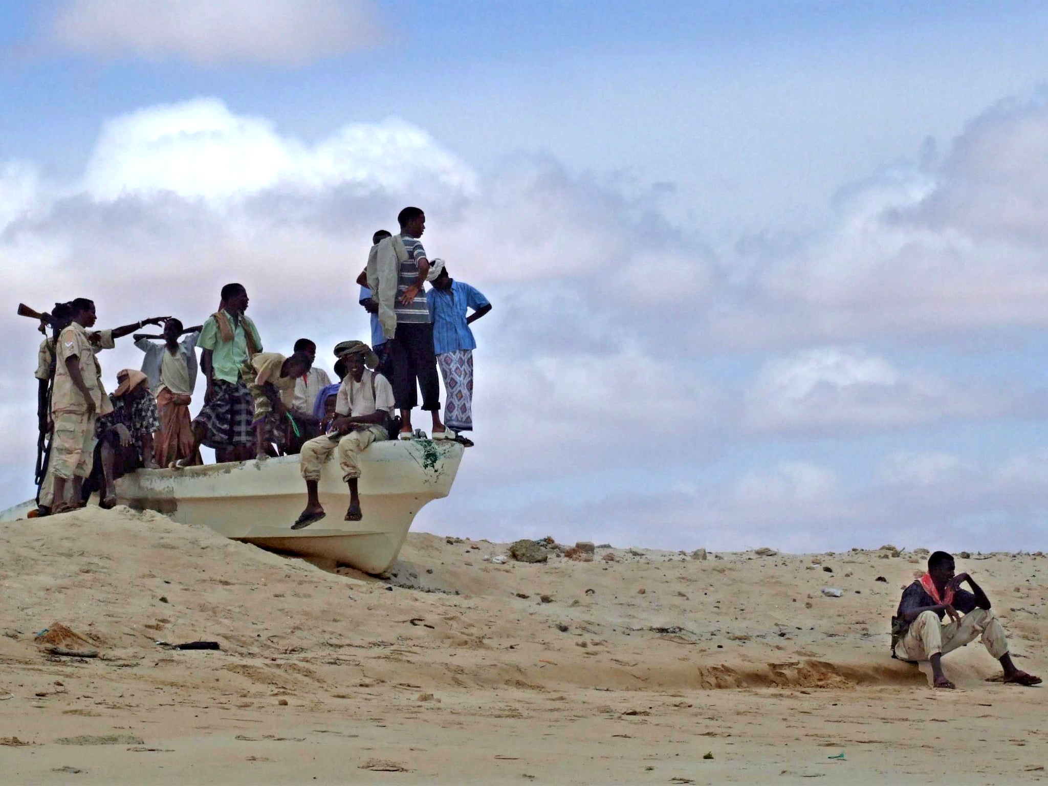 A crew of armed Somali pirates on a beach in Mogadishu