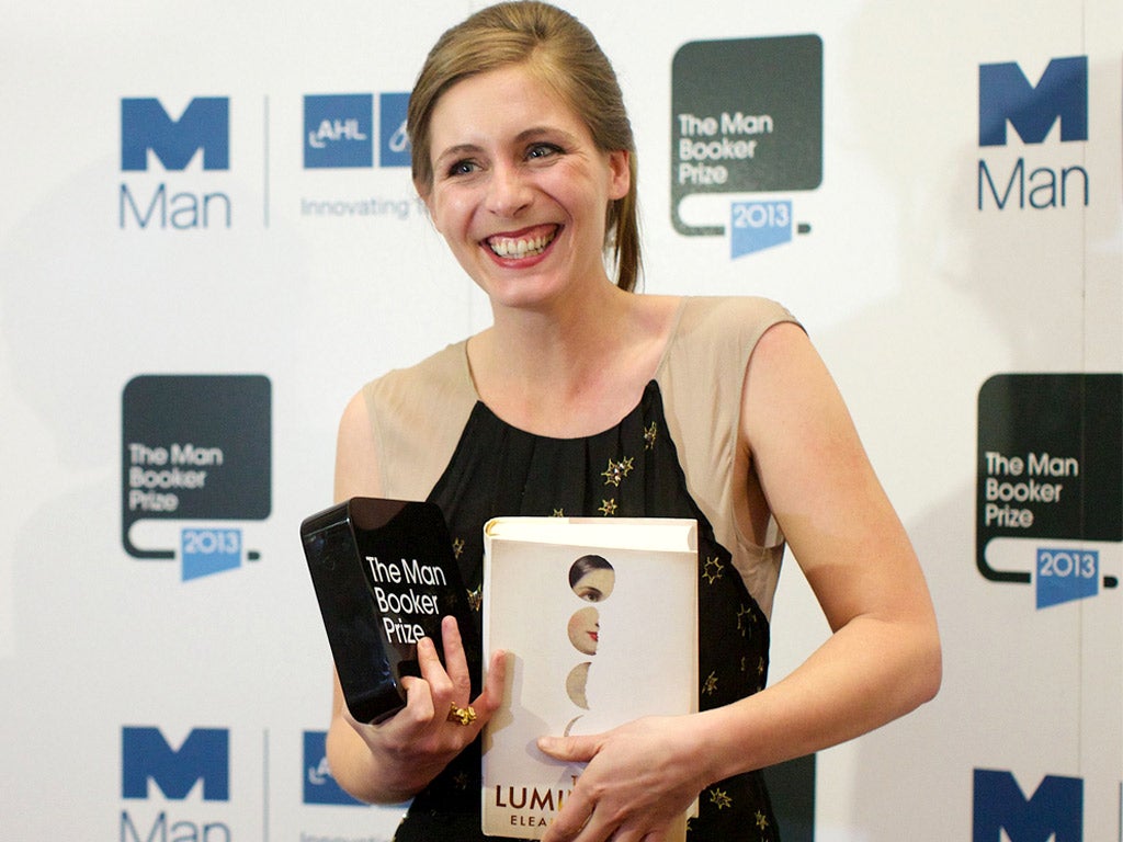 New Zealand author Eleanor Catton poses for photographs after winning the 2013 Man Booker Prize