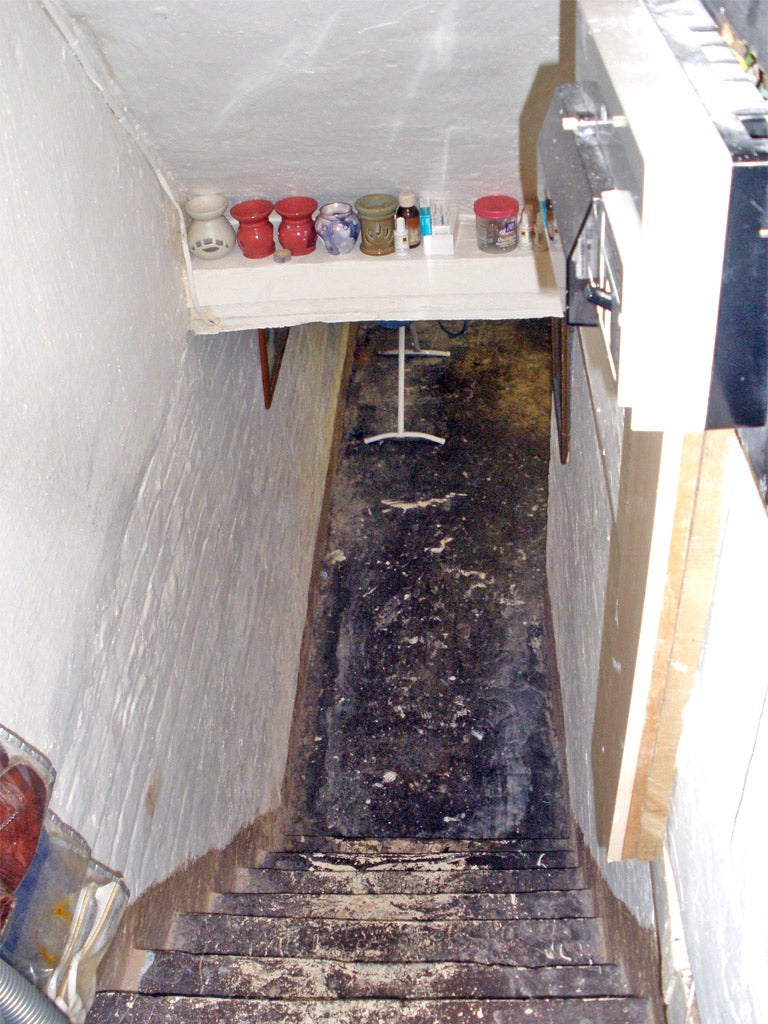 The staircase leading down to the cellar where the victim was kept