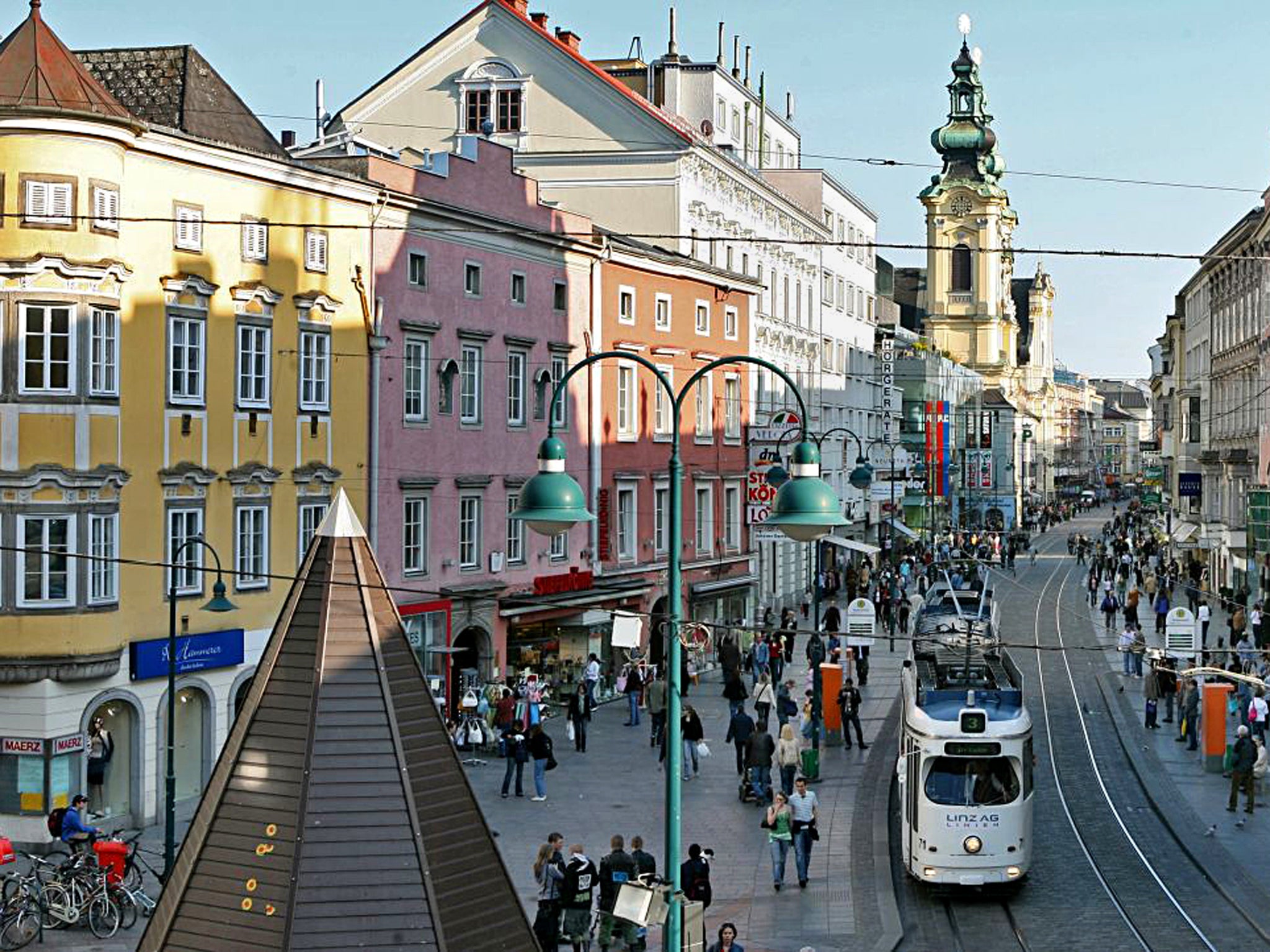 On track: a tram rolls through the city centre