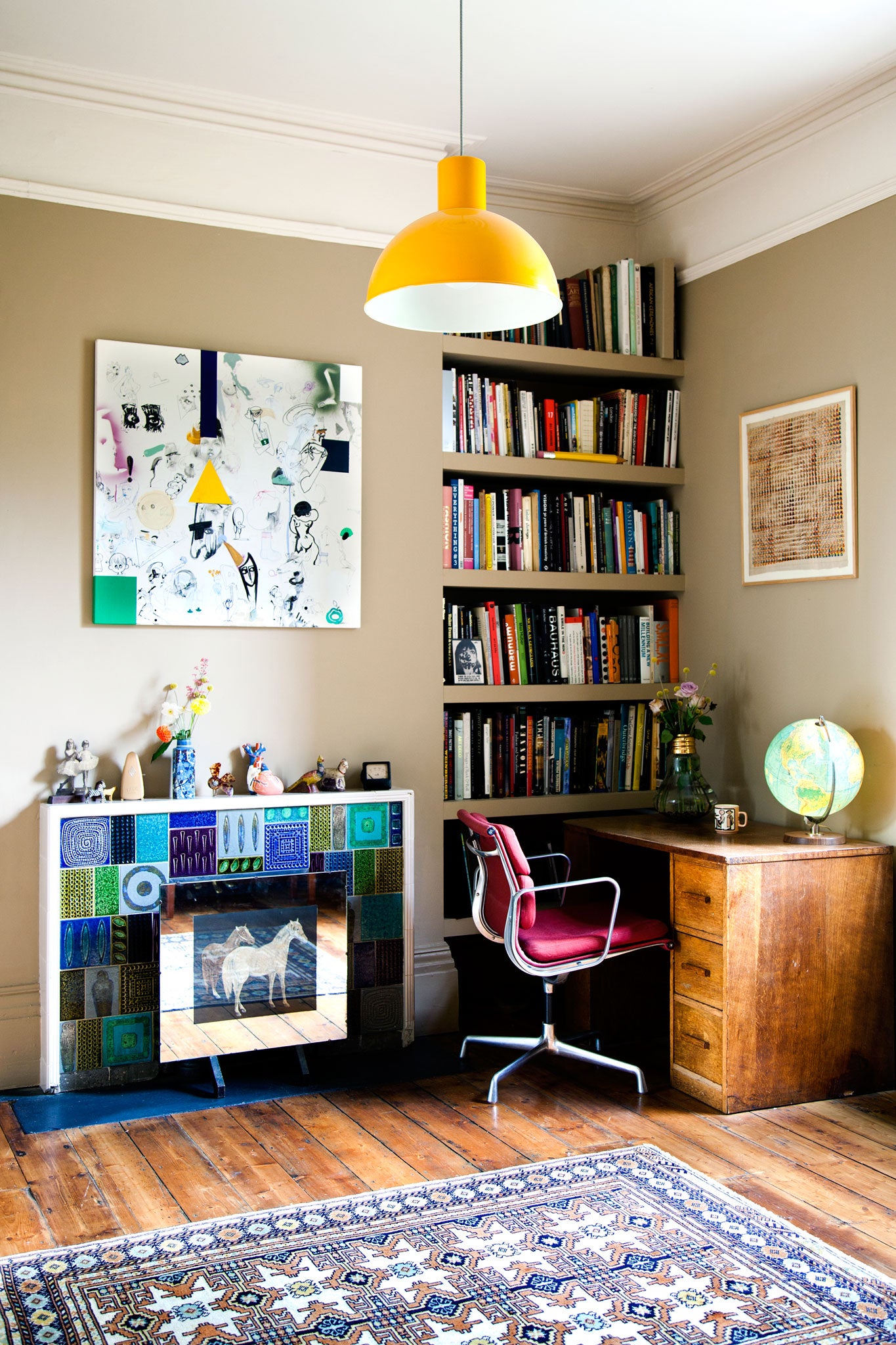 Cook's study area, with a Julie Verhoeven painting