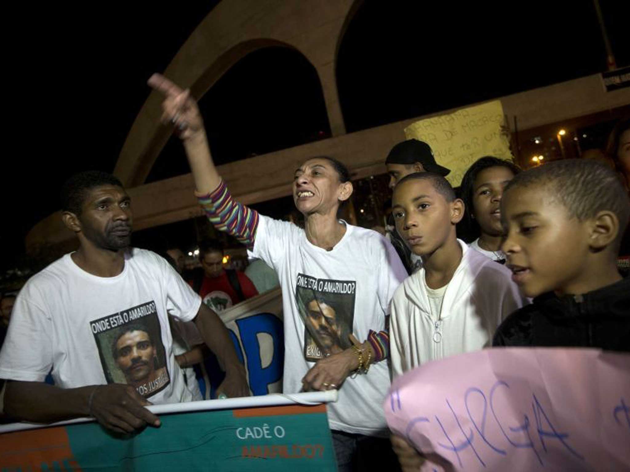 Elizabeth Gomes, second from left, demands information about her disappeared husband, Amarildo de Souza, in August of this year