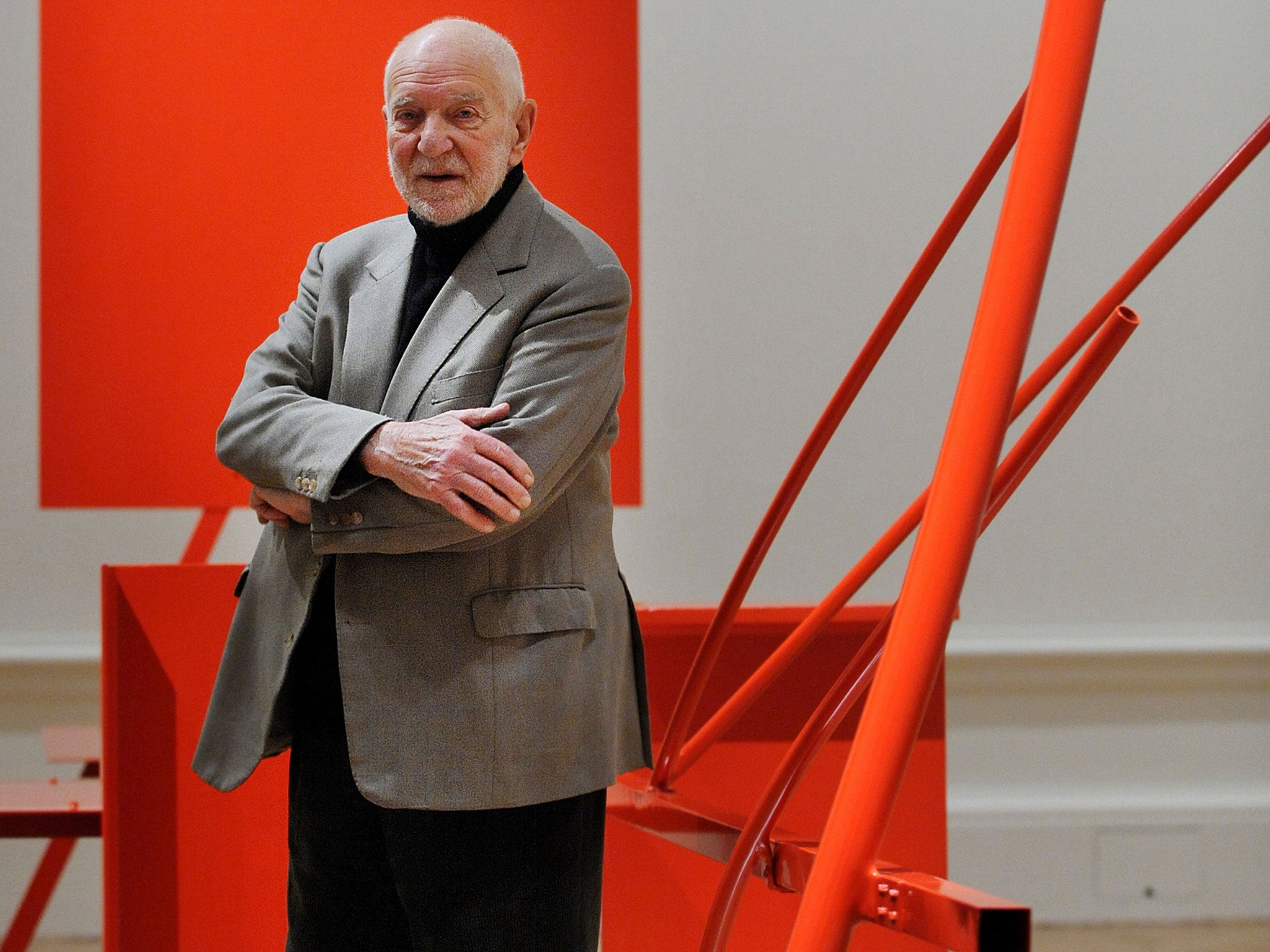 Sir Anthony Caro poses with his sculpture 'Early One Morning' in 2011