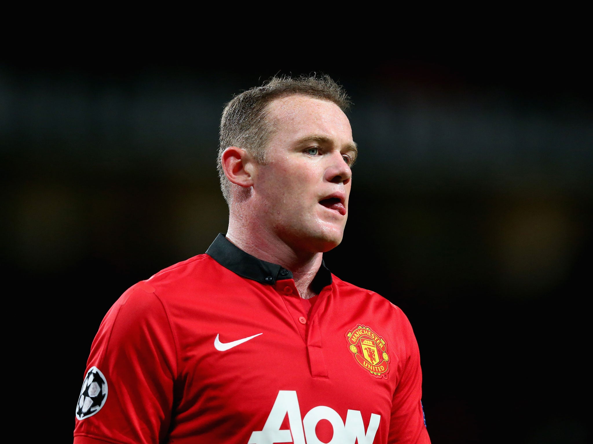 Wayne Rooney of Manchester United looks on