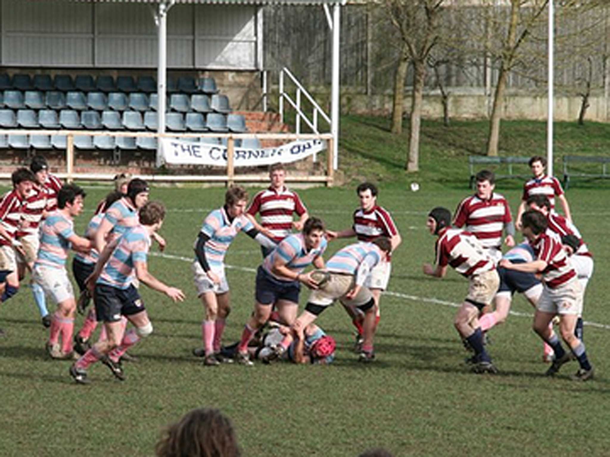 A historic image of Pembroke College's rugby player's in action, from Rugby Football Club's homepage