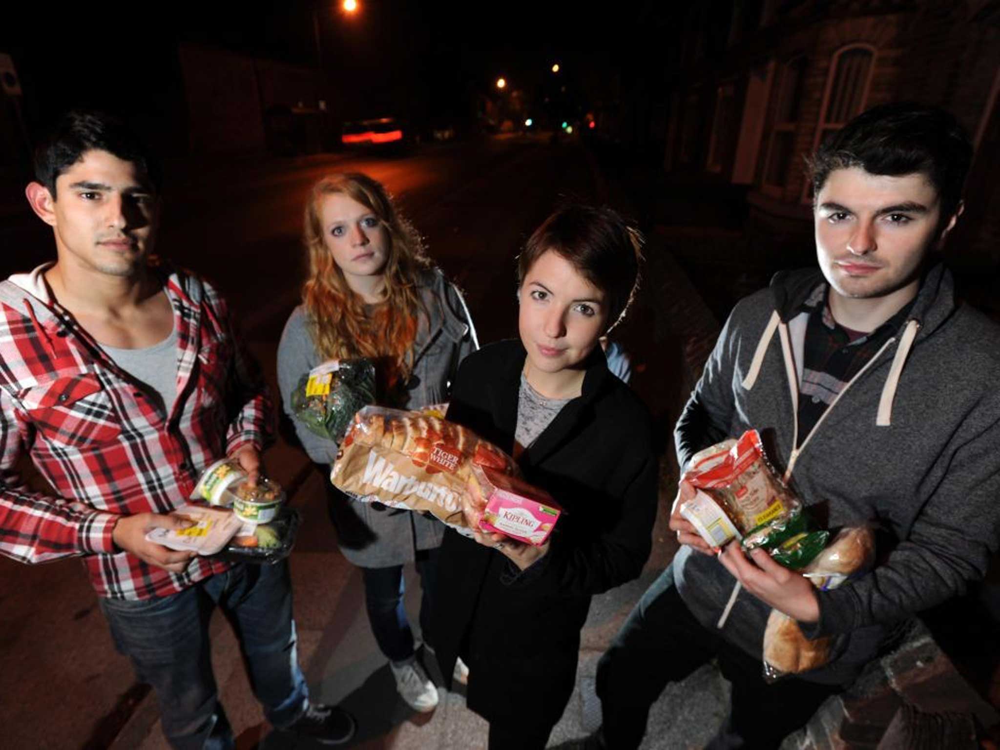 Bin raiding team with food items retrieved from supermarket bins in York - left to right: Santiago Parilli, Ursula Wild, Jo Barrow, Robin Lee