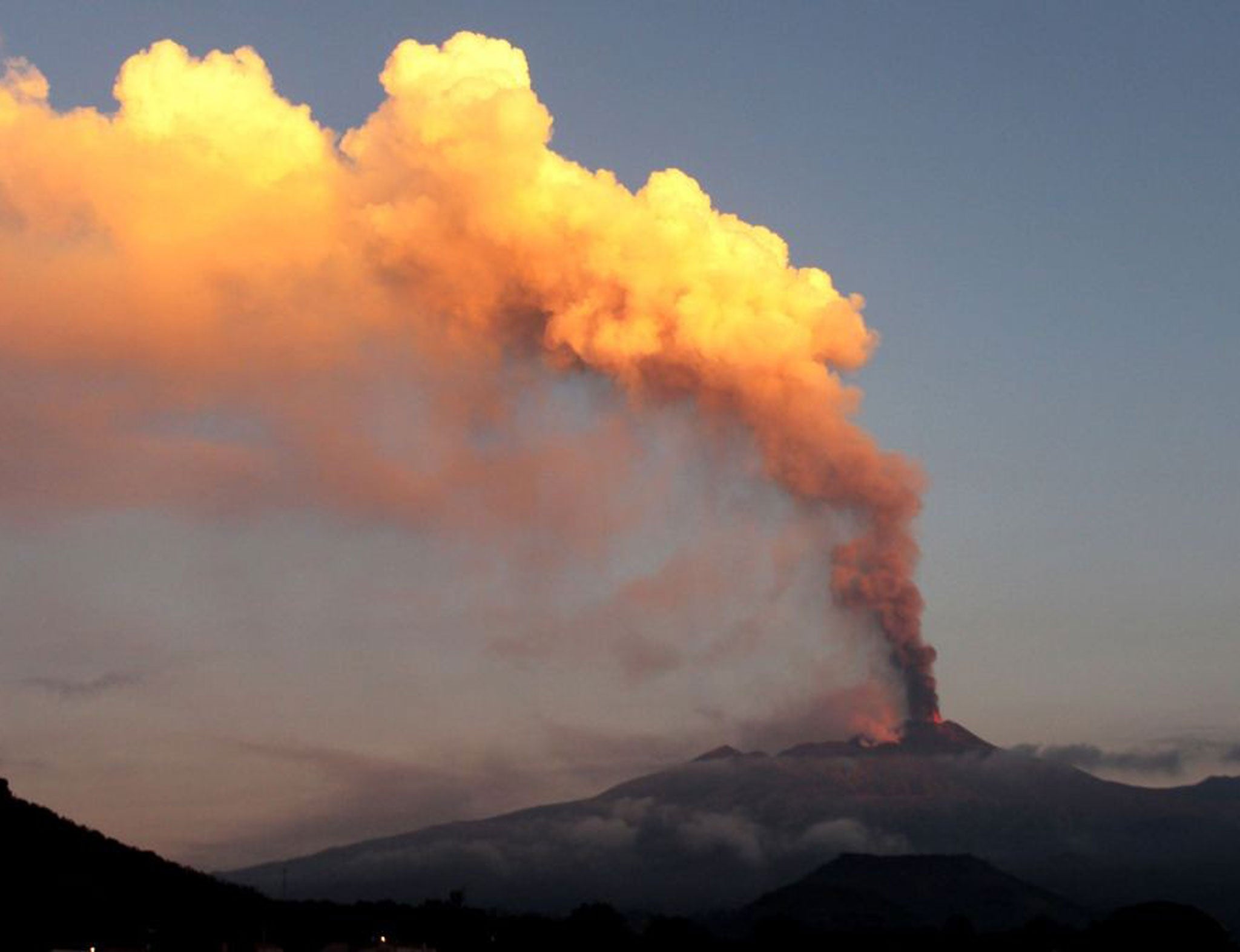 Mount Etna sends a fiery plume of smoke into the Sicily sky on Saturday