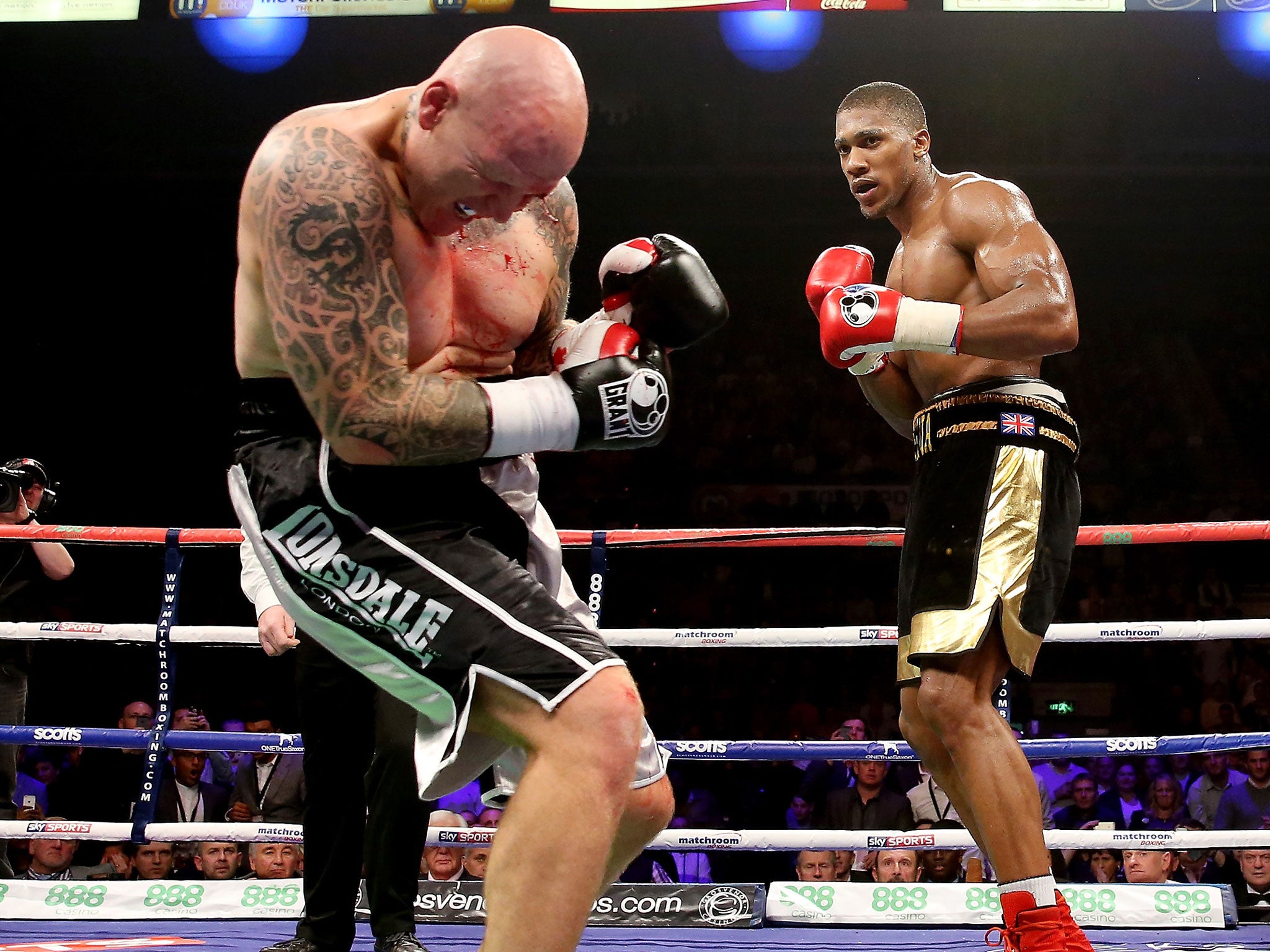 Anthony Joshua lands a blow on opponent Paul Butlin, who he went on to stop inside two rounds