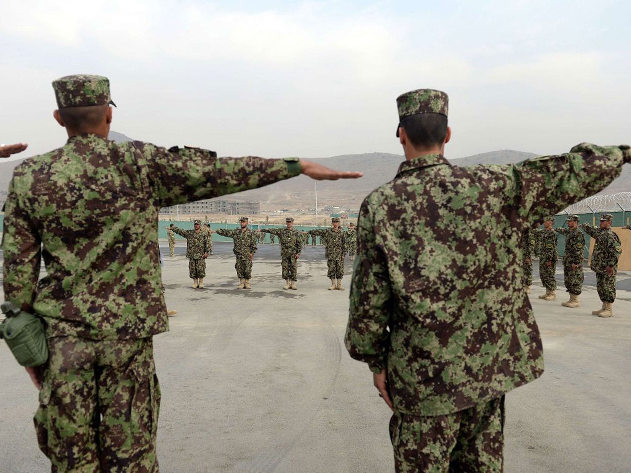 Recruits last week performing drills at the Afghanistan National Army Officers' Academy (ANAOA) - now the site of a green-on-blue shooting