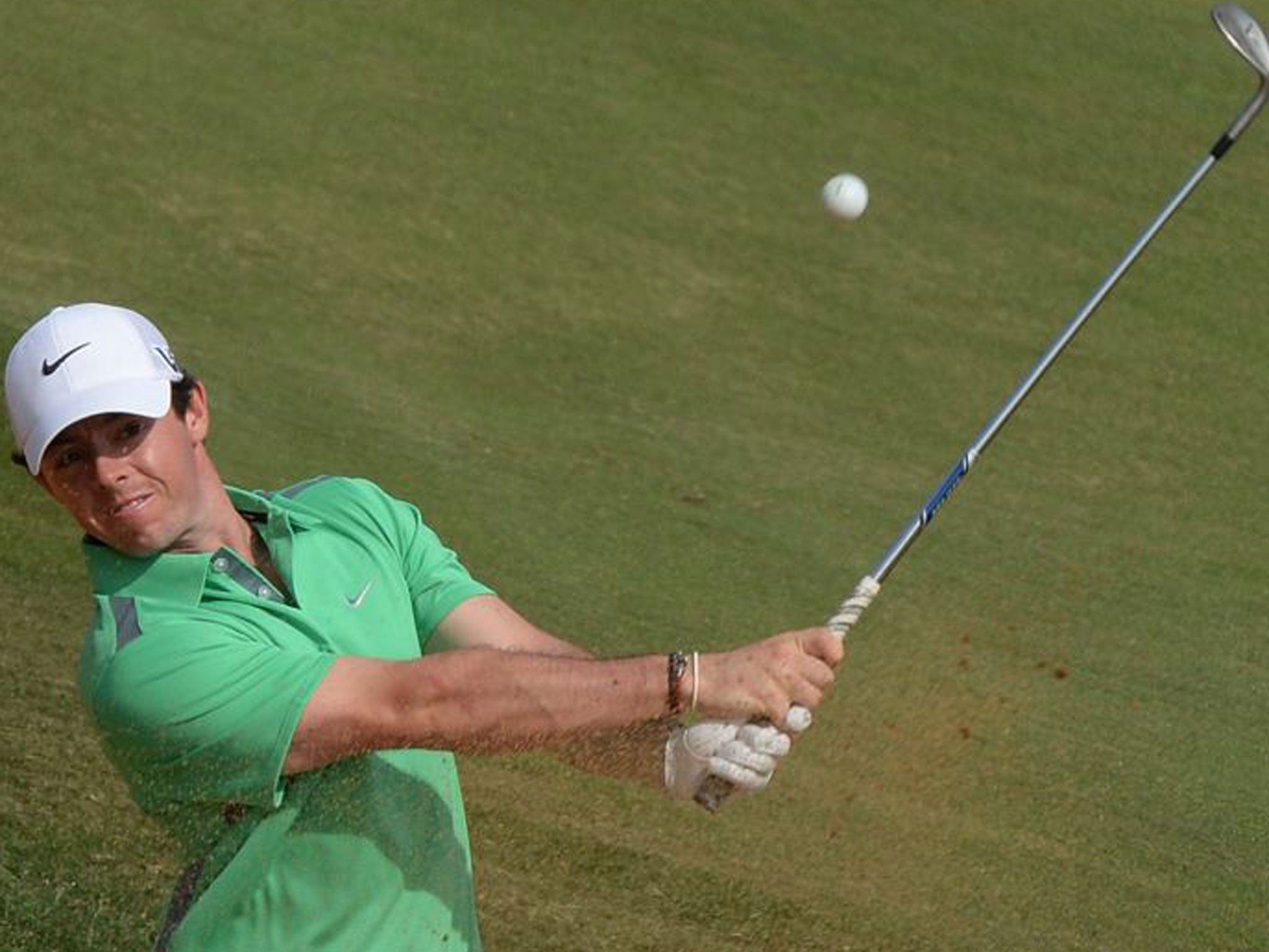 Rory McIlroy plays from the bunker at the seventh hole on the final day of the BMW Shanghai Masters