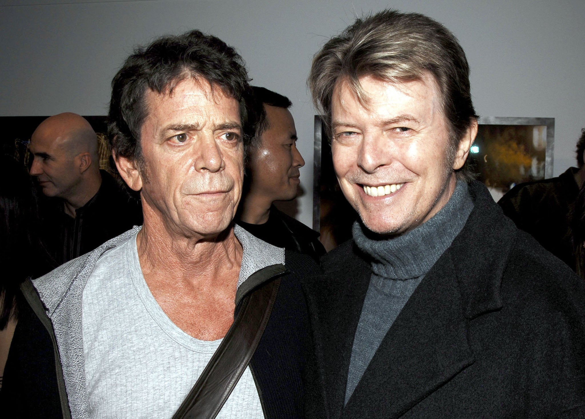 Lou Reed and David Bowie attend the opening of Reed's photography exhibition in New York City, 2006.