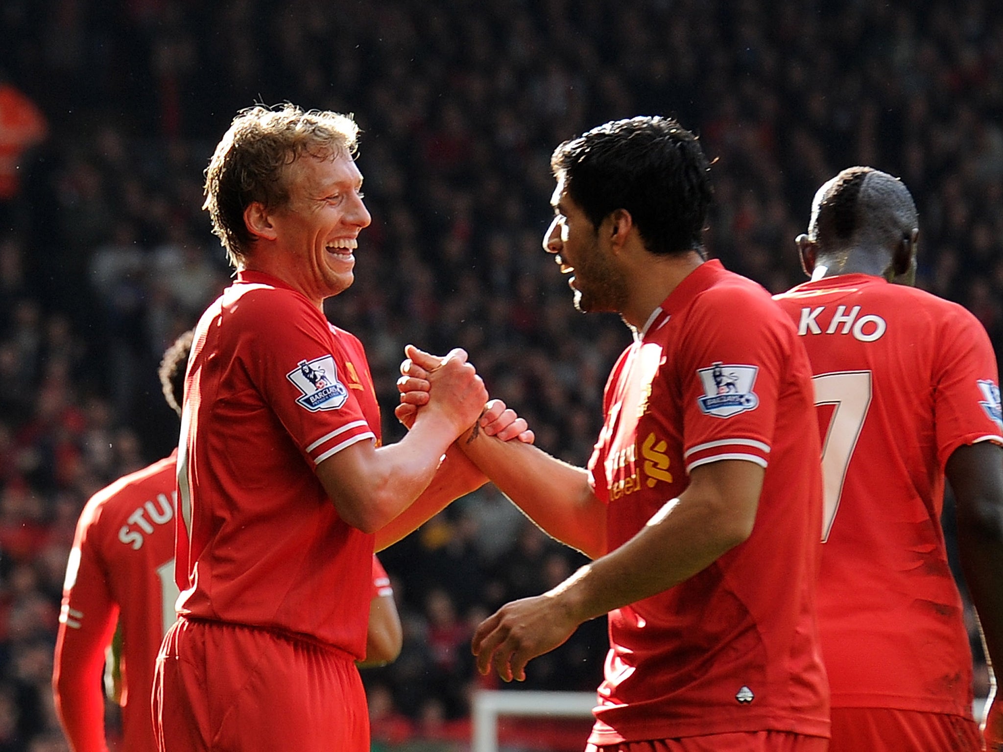 Lucas Leiva celebrates with Luis Suarez during the 4-1 win over West Brom