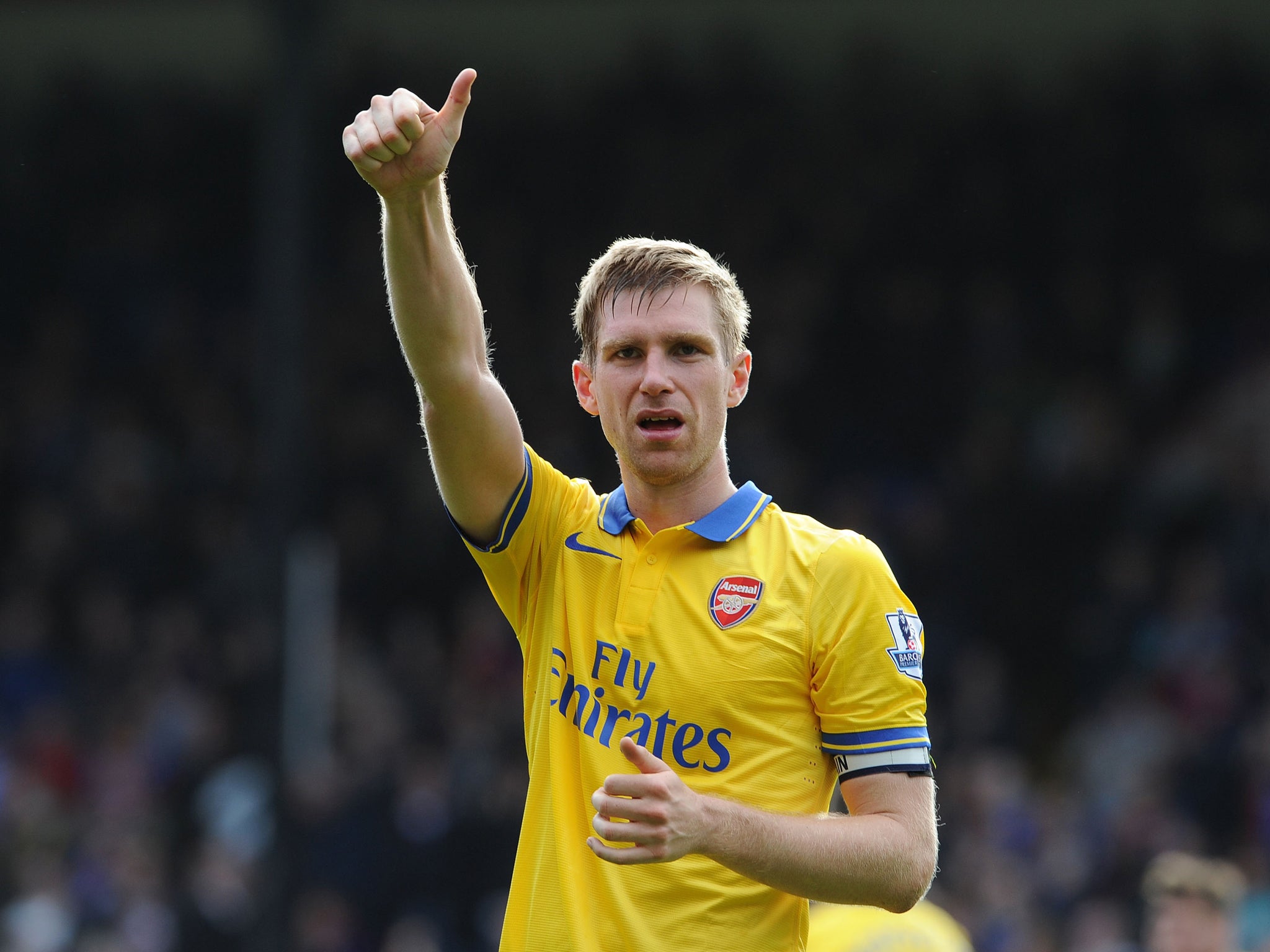 Arsenal defender Per Mertesacker celebrates the 2-0 win over Crystal Palace