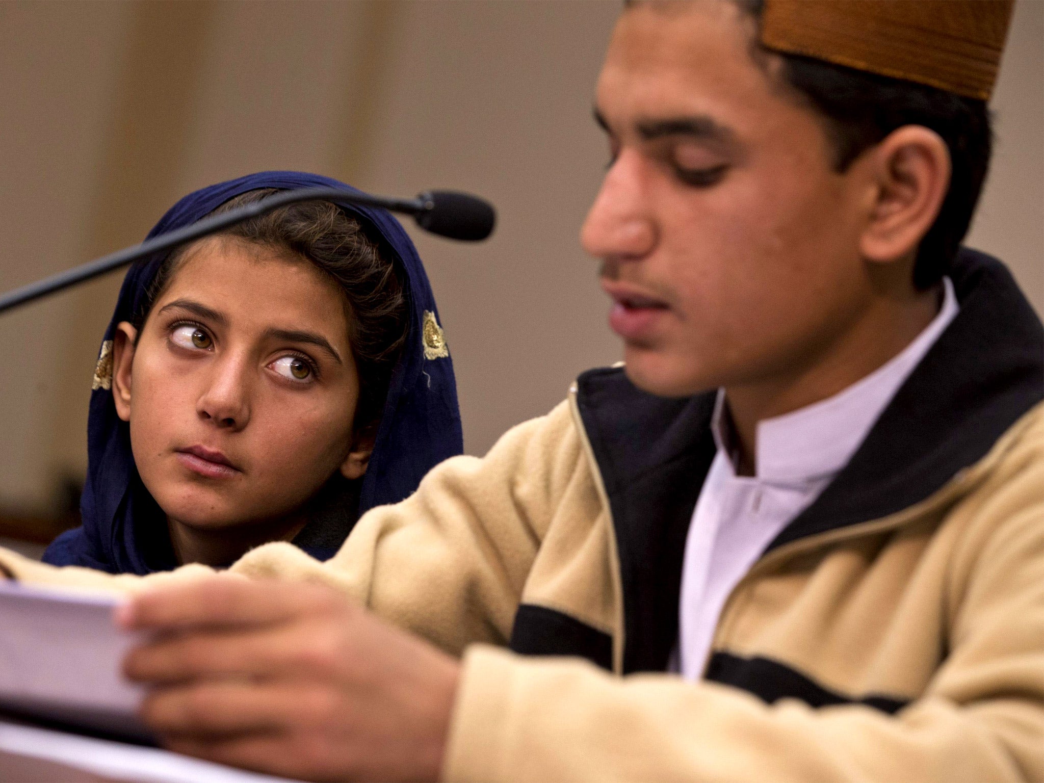 Nabila Rehman watches on as her brother Zubair reads a statement about the day their grandmother Mammana Bibi was killed