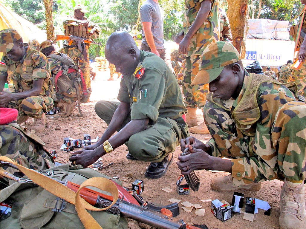 South Sudanese soldiers at a US base in Nzara load bullets into their AK-47s before a raid in September on a Lord’s Resistance Army camp in Congo