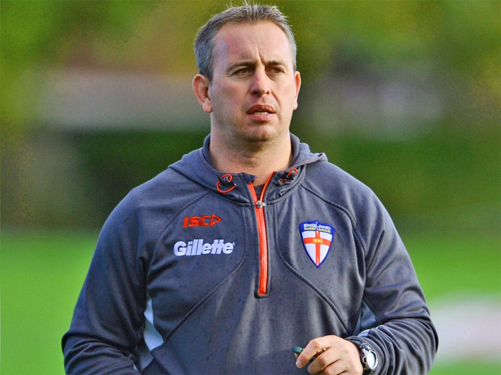 England head coach Steve McNamara looks on during training