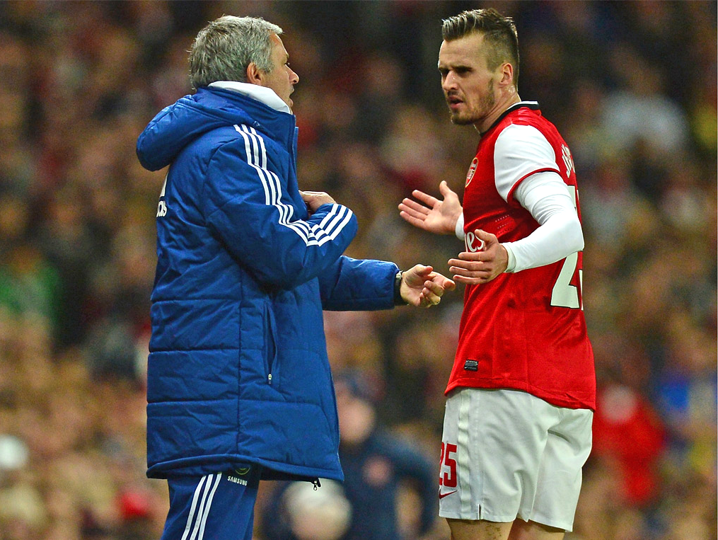 Jose Mourinho and Carl Jenkinson exchange words