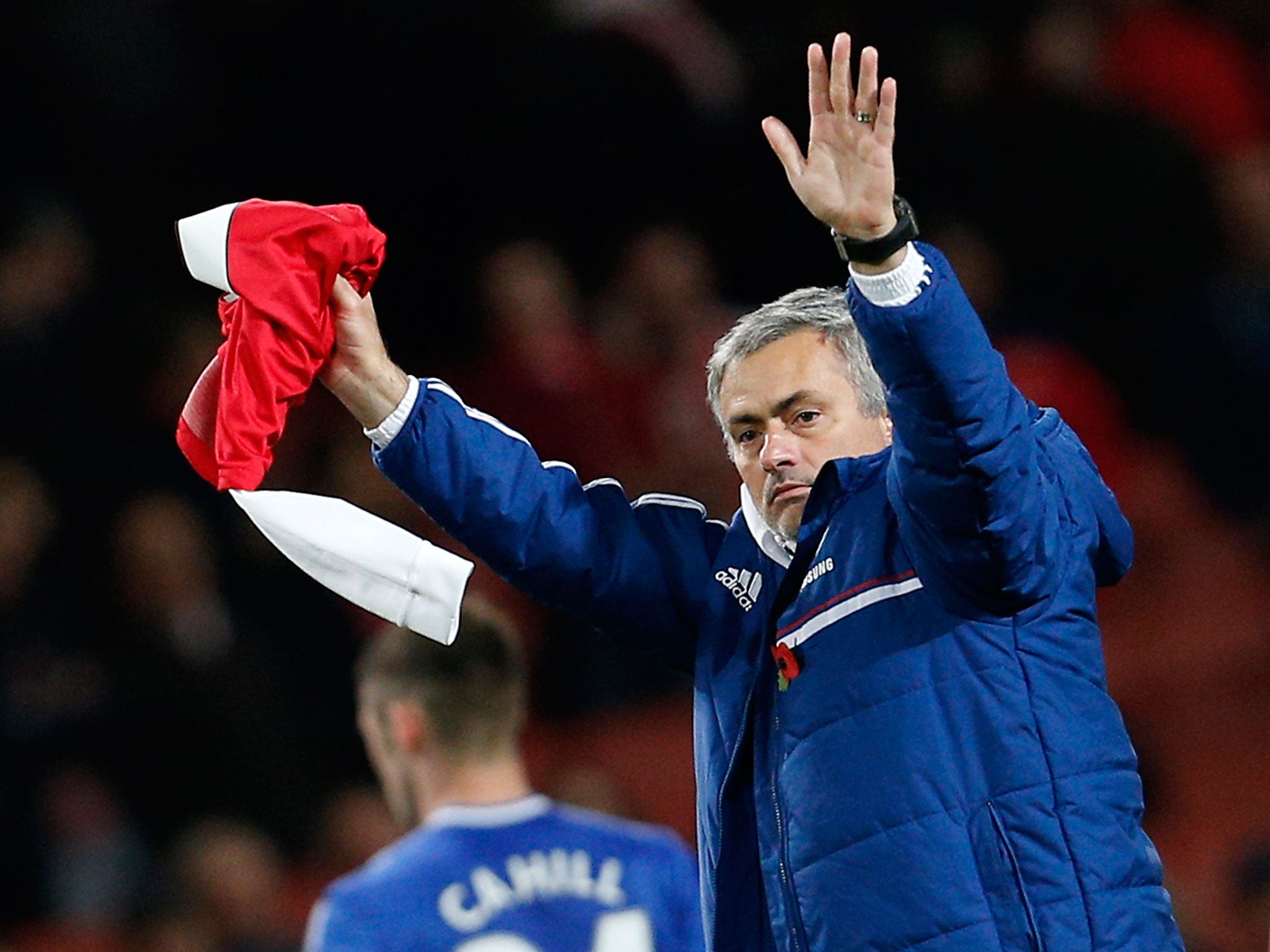 Chelsea's Portuguese manager Jose Mourinho gestures toward Chelsea supporters