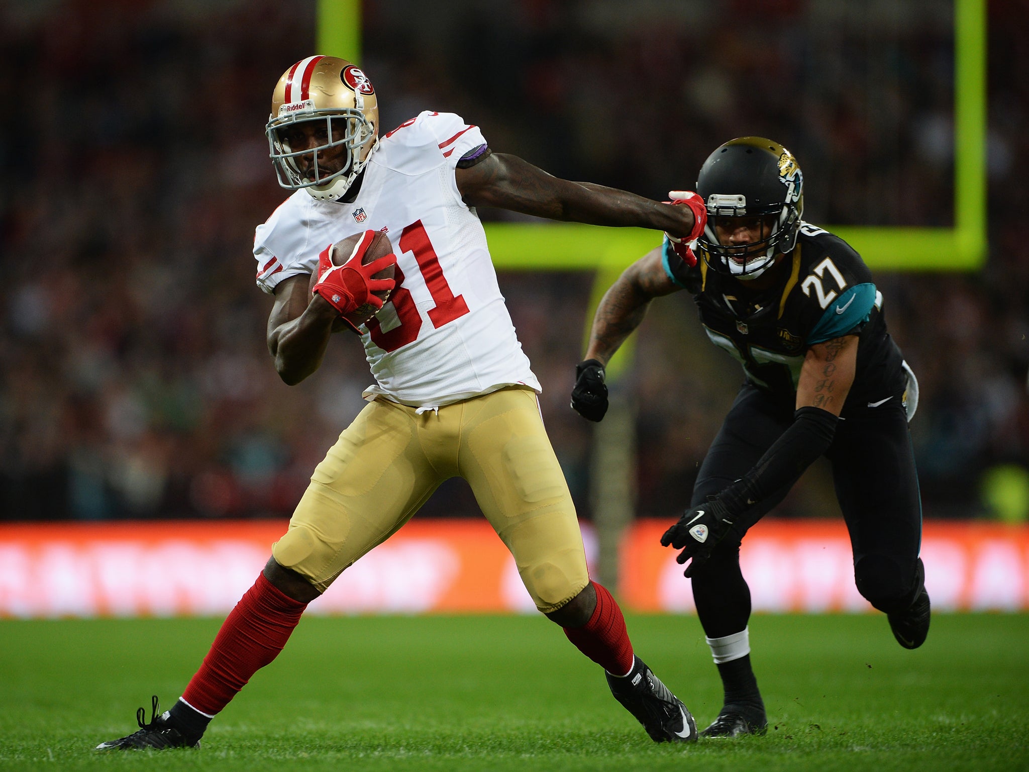 San Francisco 49ers wide receiver Anquan Boldin breaks free from a diving Dwanye Gratz of the Jacksonville Jaguars