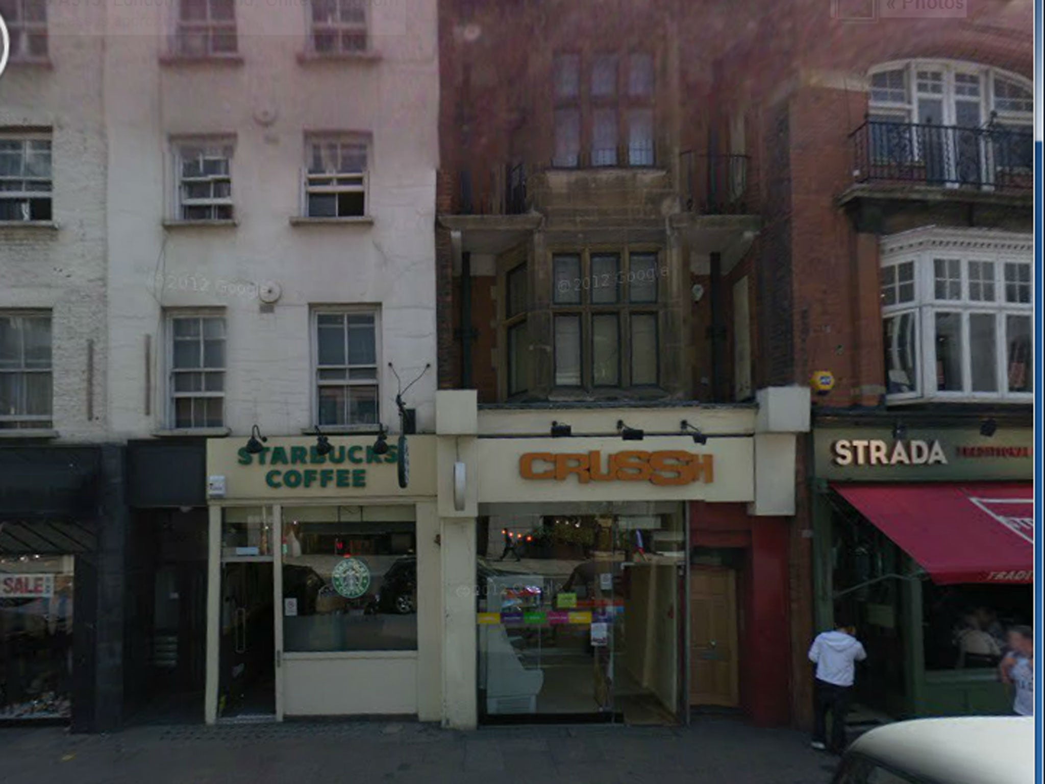 The toilet is located in a storeroom between the first and second floors of the building pictured