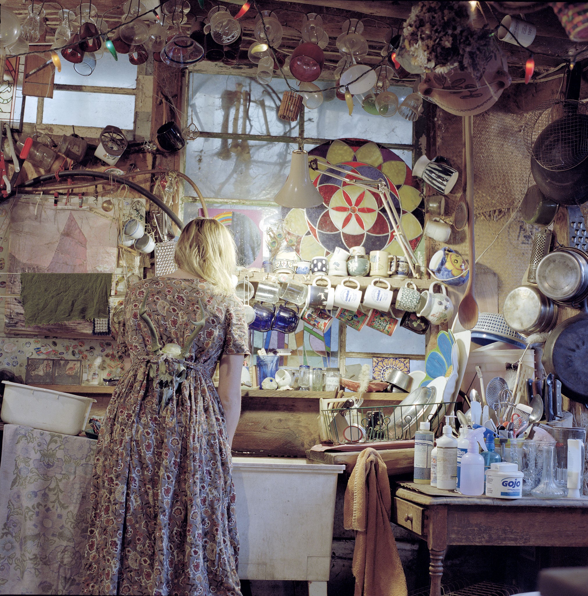 Moore often places herself in her photographs of this sanctuary, her face hidden