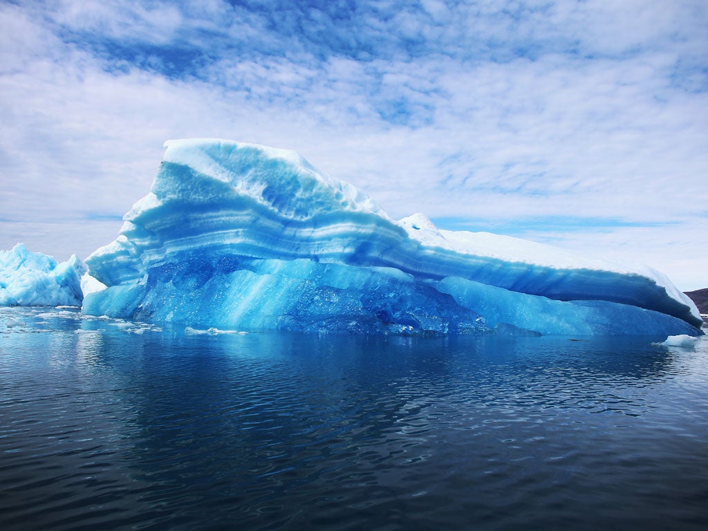 Green and sparkling: Calved icebergs seen floating on the sea near Qaqortoq, Greenland, last July