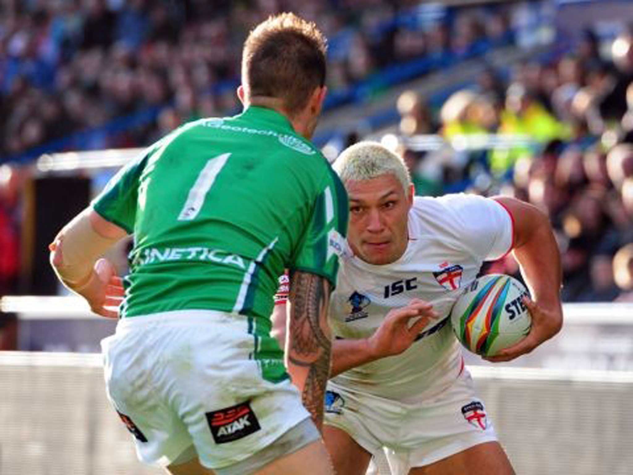 Hat trickery: England’s Ryan Hall prepares to beat James Mendeika of Ireland to score the third of his tries yesterday