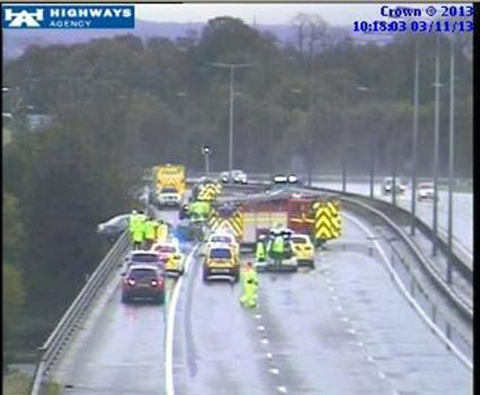 Dramatic images from the Highways Agency show the vehicle teetering over the edge of the M6 carriageway at junction 23, near Haydock.