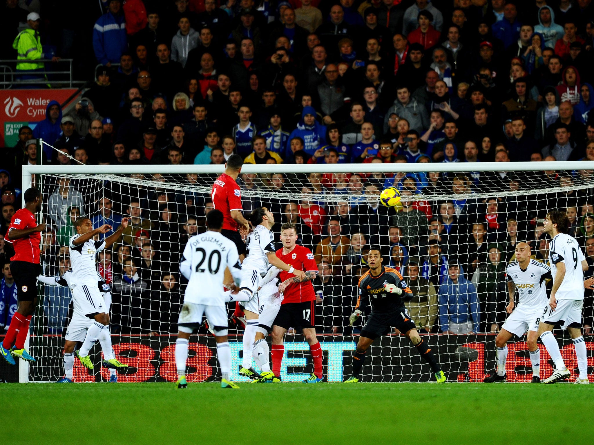 CARDIFF, WALES - NOVEMBER 03: Steven Caulker of Cardiff City rise highest to score their first goal with a header