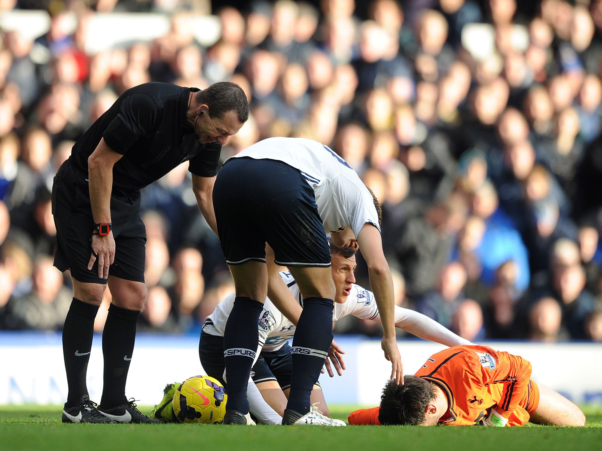 Lloris' (in orange) collision with Romelu Lukaku visibly left the Frenchman unconscious for a short time