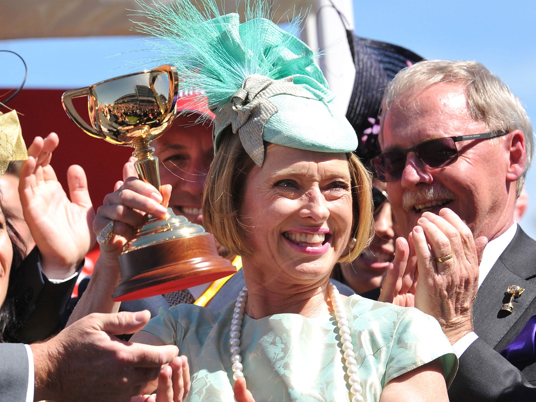 Gai Waterhouse holds aloft the Melbourne Cup