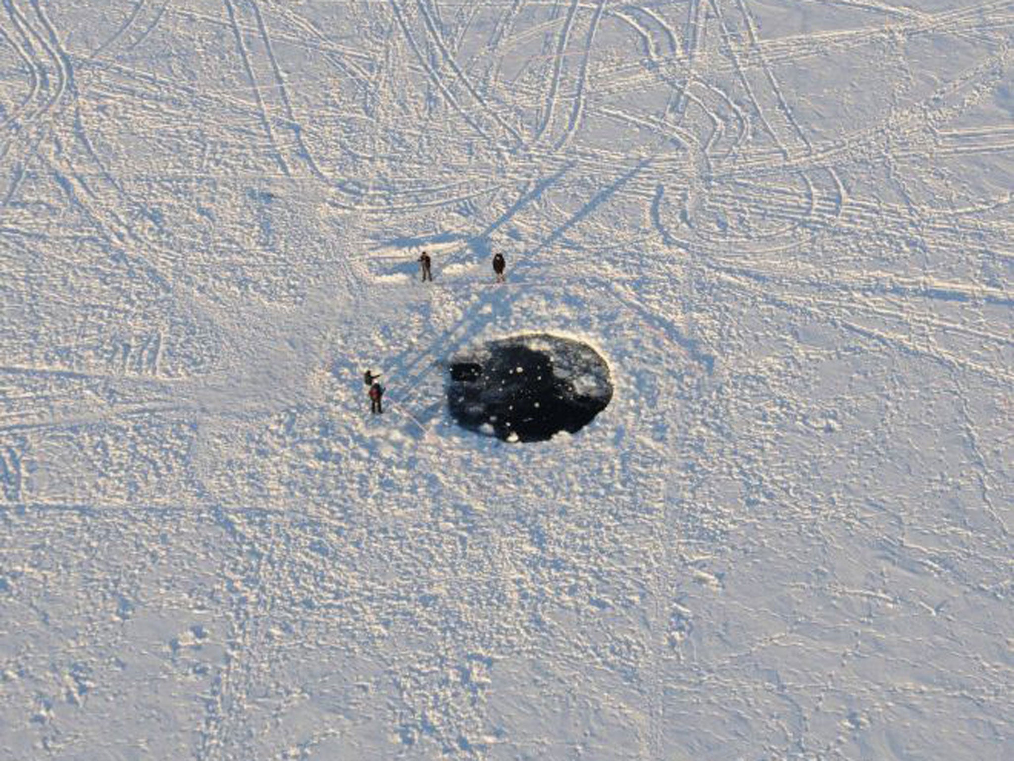 The impact site of the main mass of the Chelyabinsk meteorite in the ice of Lake Chebarkul