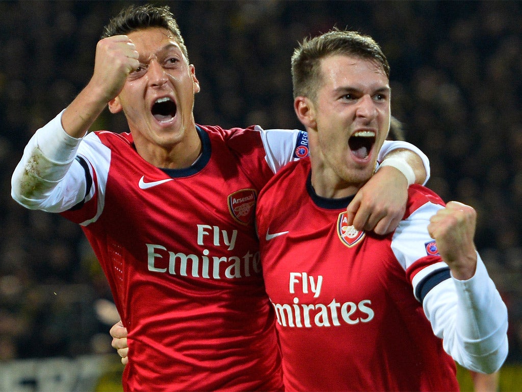 Mesut Ozil celebrates with goalscorer Aaron Ramsey (Getty)